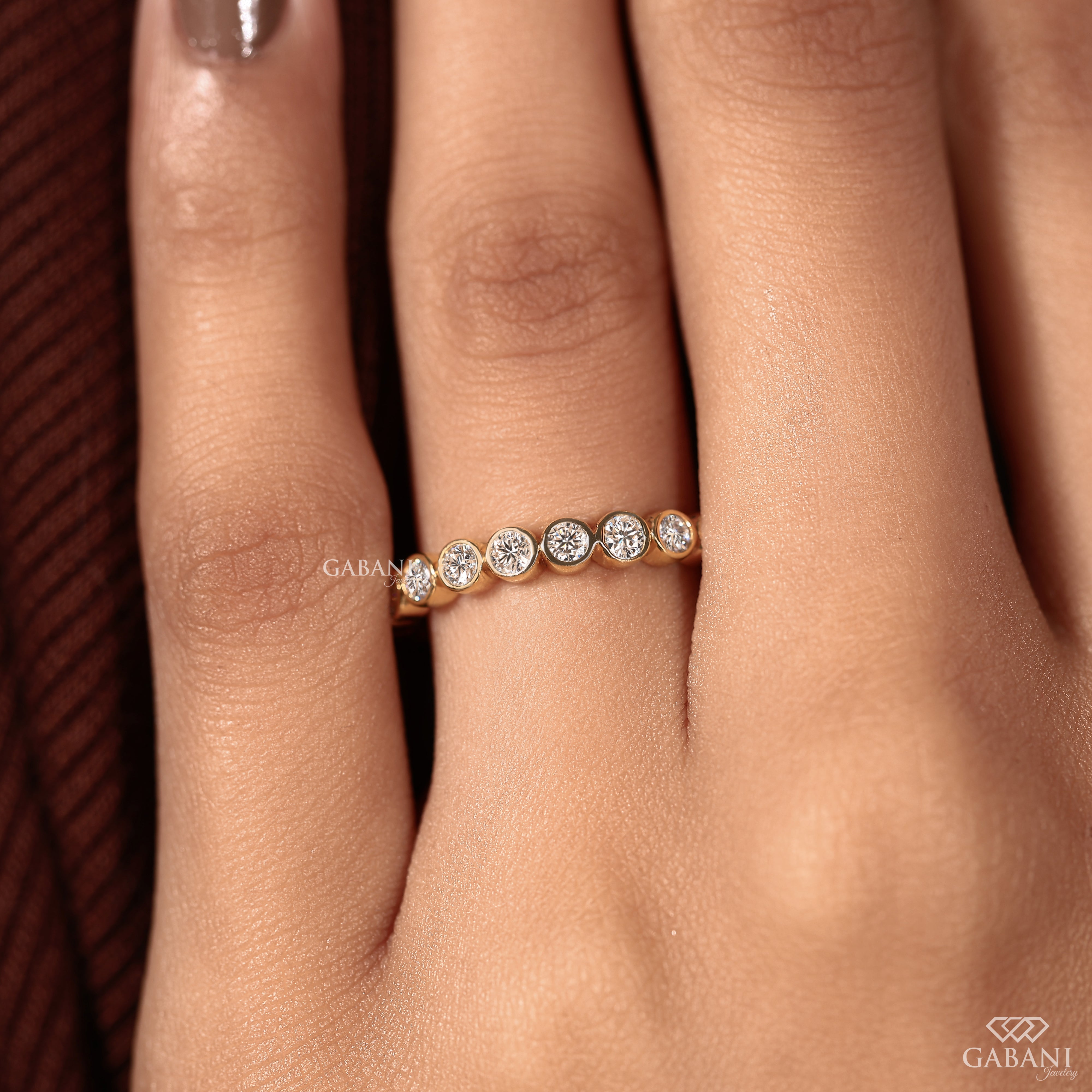 Yellow gold bezel set diamond wedding band