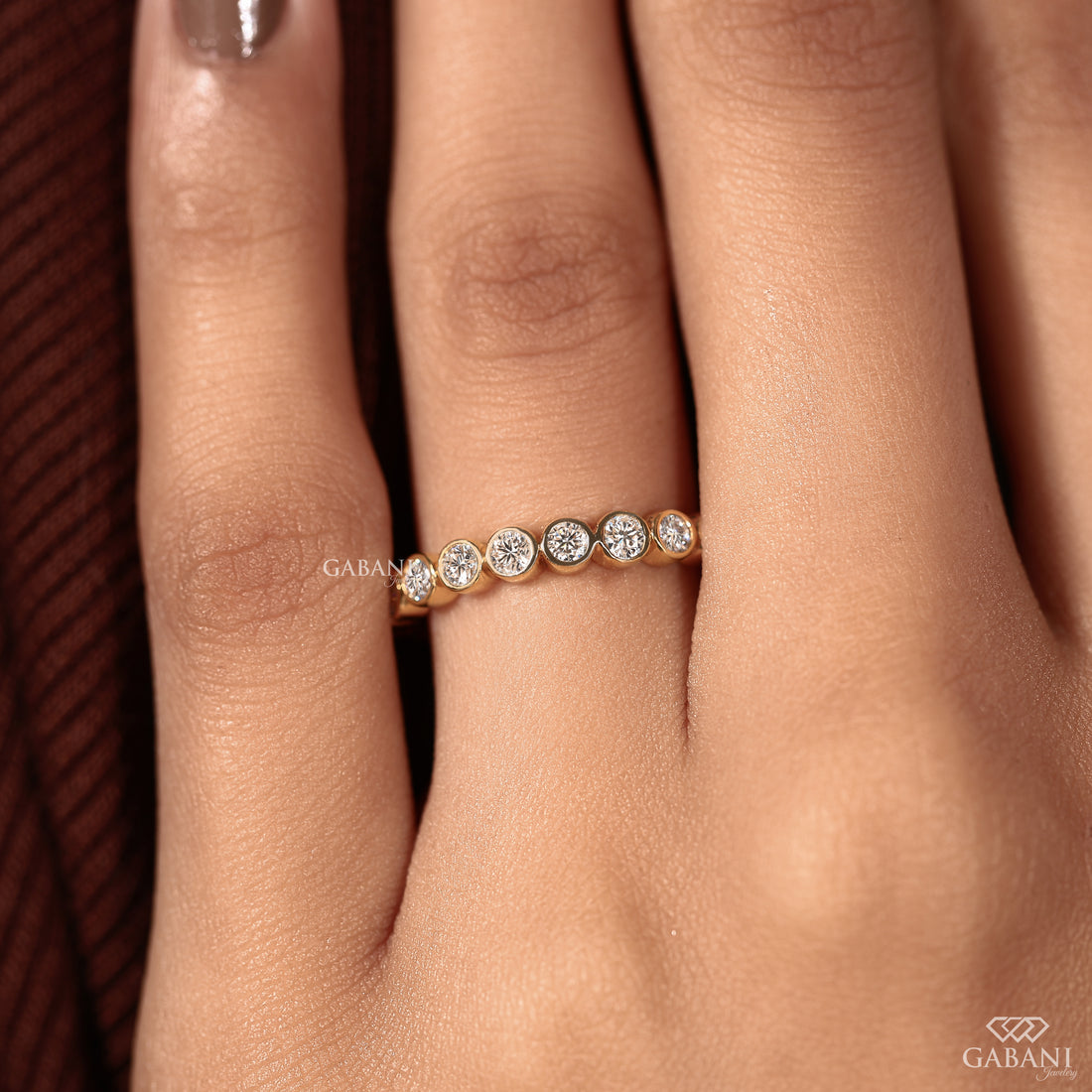 Yellow gold bezel set diamond wedding band