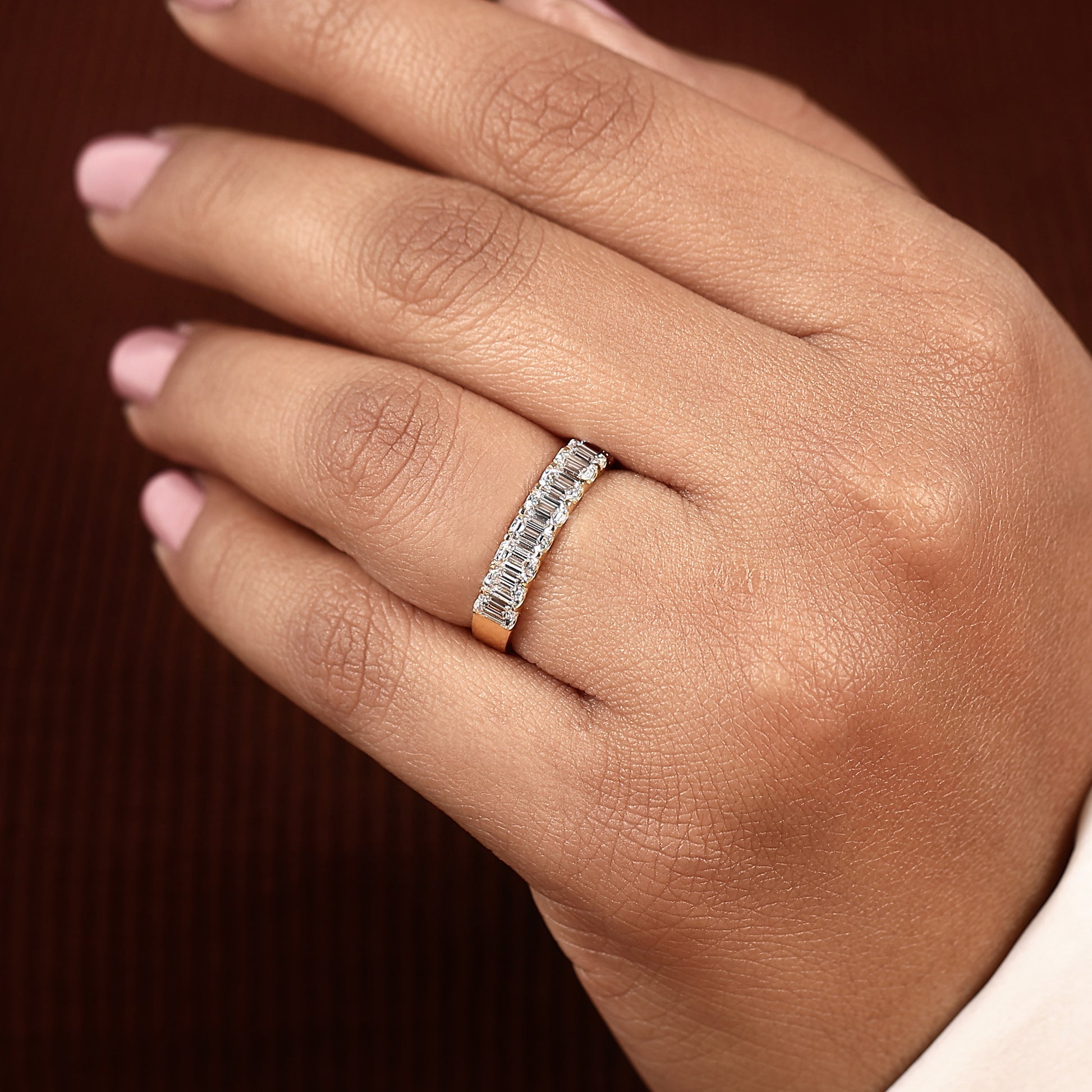 modern emerald cut lab diamond ring in yellow gold with comfort fit and low profile band
