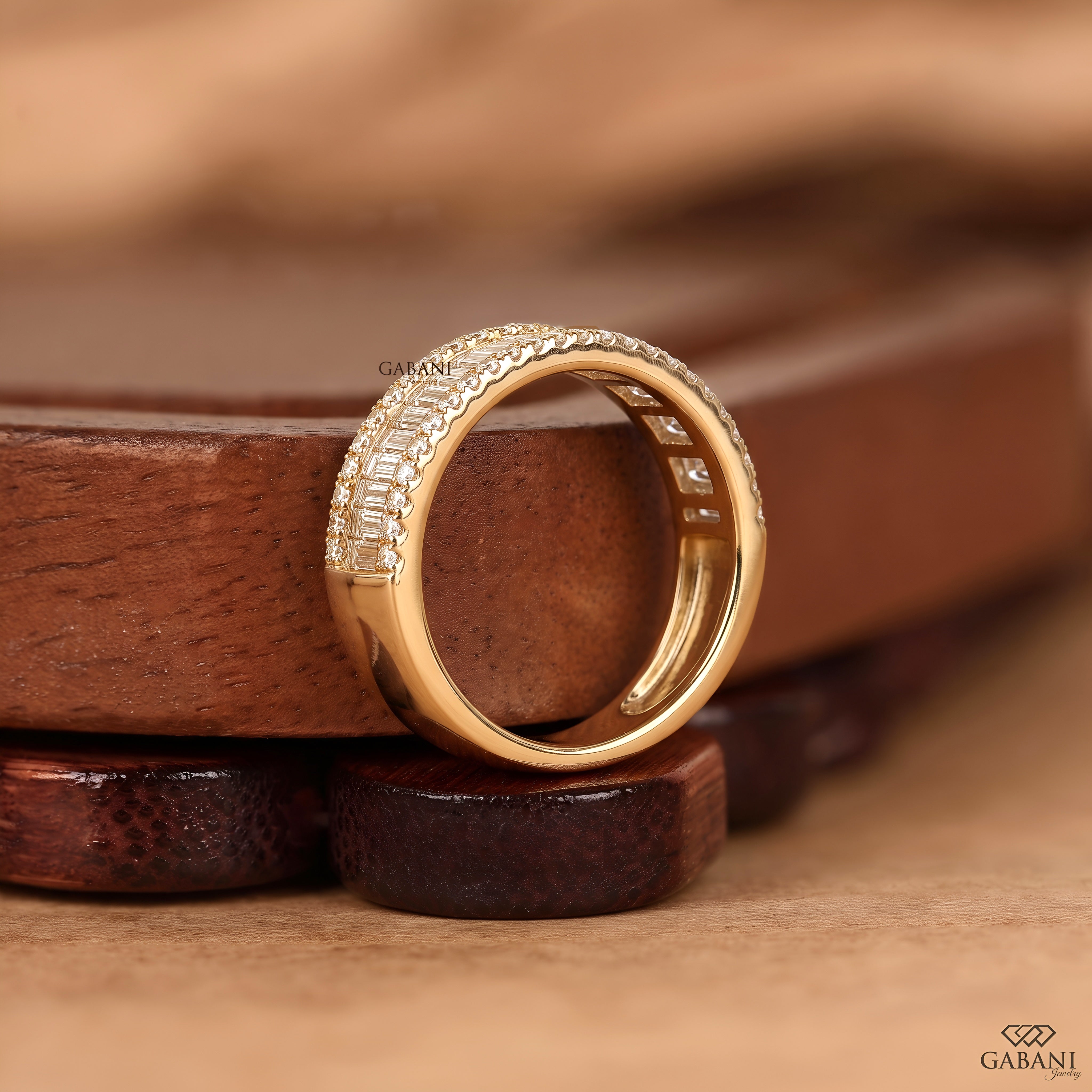 Side view of wide yellow gold lab grown diamond wedding band with baguette and round diamonds