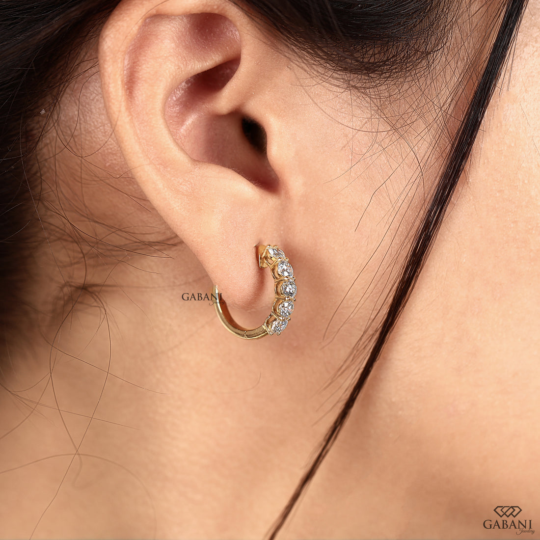 Round cut lab grown diamond huggie earrings crafted in yellow gold
