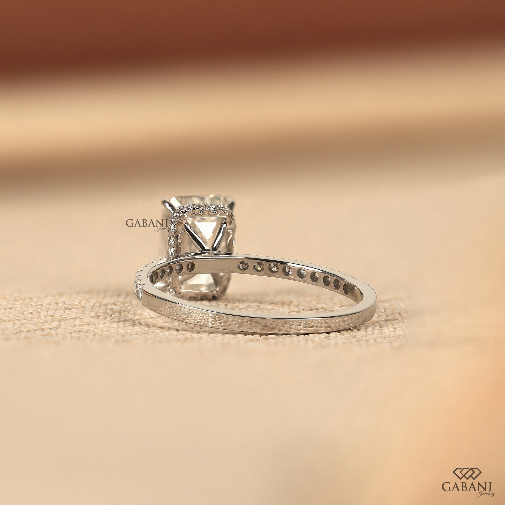 minimal white gold ring with emerald cut lab created diamond and french pave accent