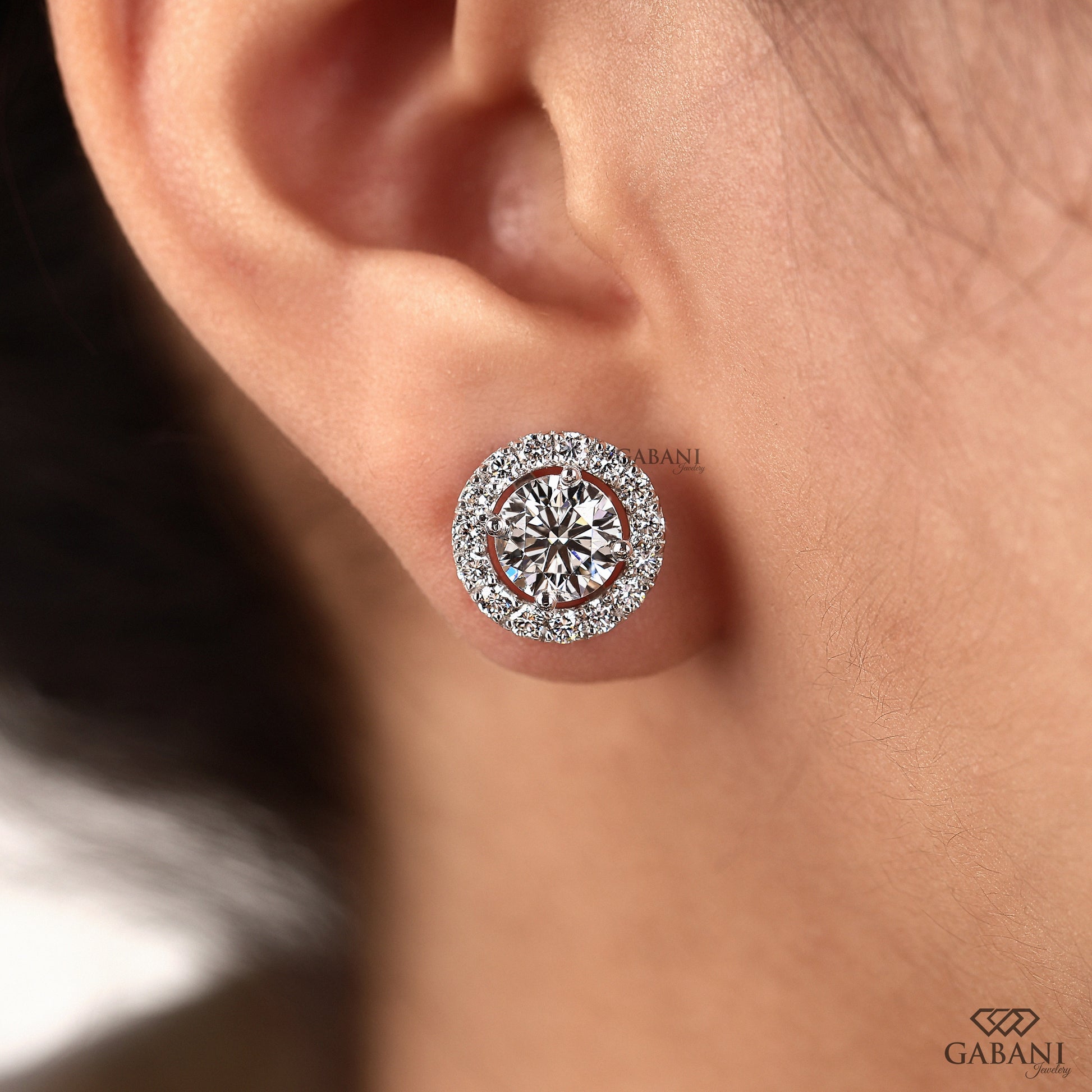 White gold round halo studs crafted by GABANI JEWELRY
