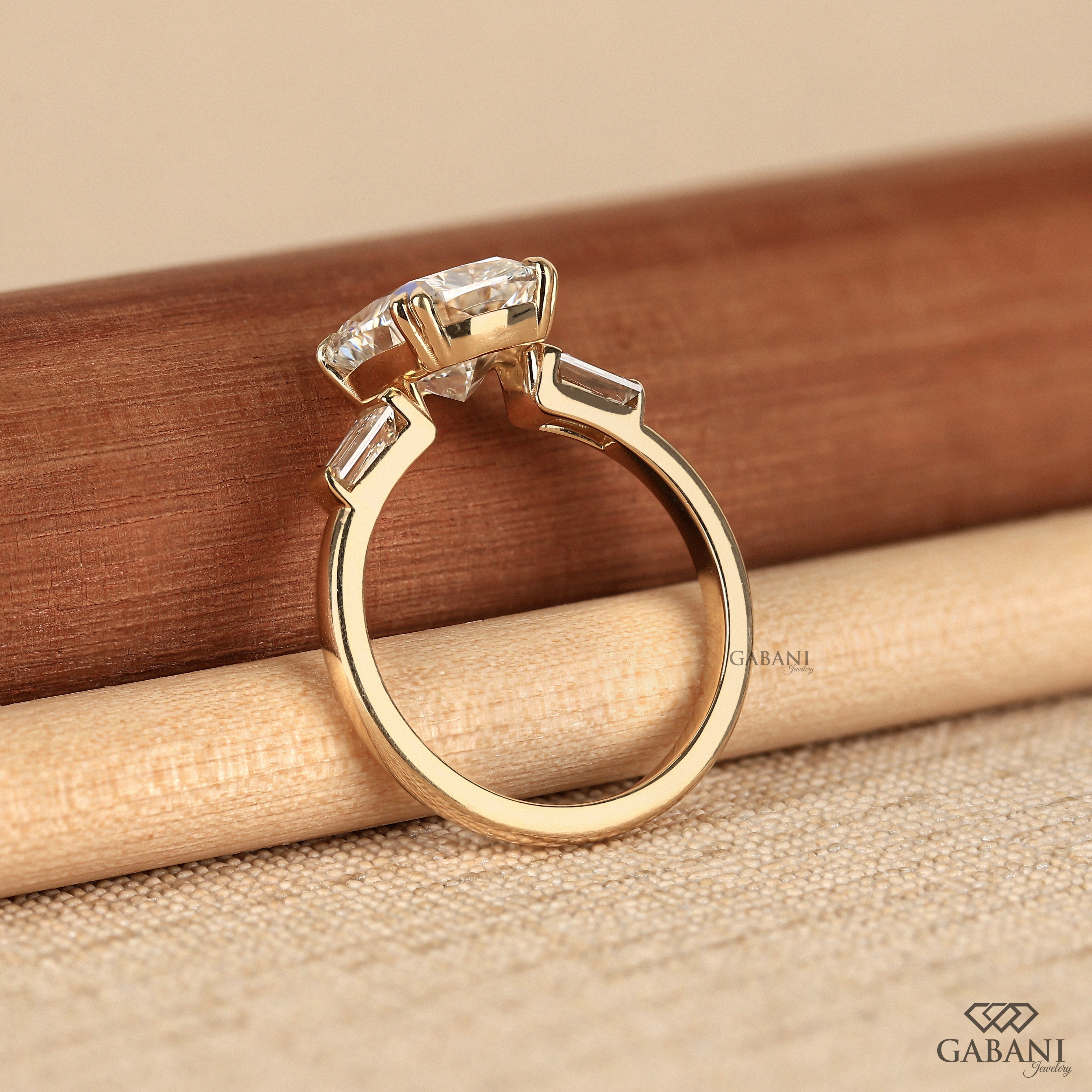 Standing view of elongated cushion cut lab grown diamond ring in 14K yellow gold