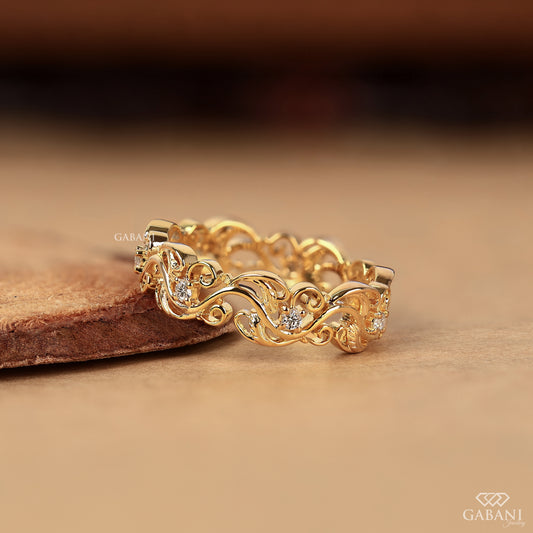 leaf and vine eternity wedding band with lab grown diamonds in 14k yellow gold