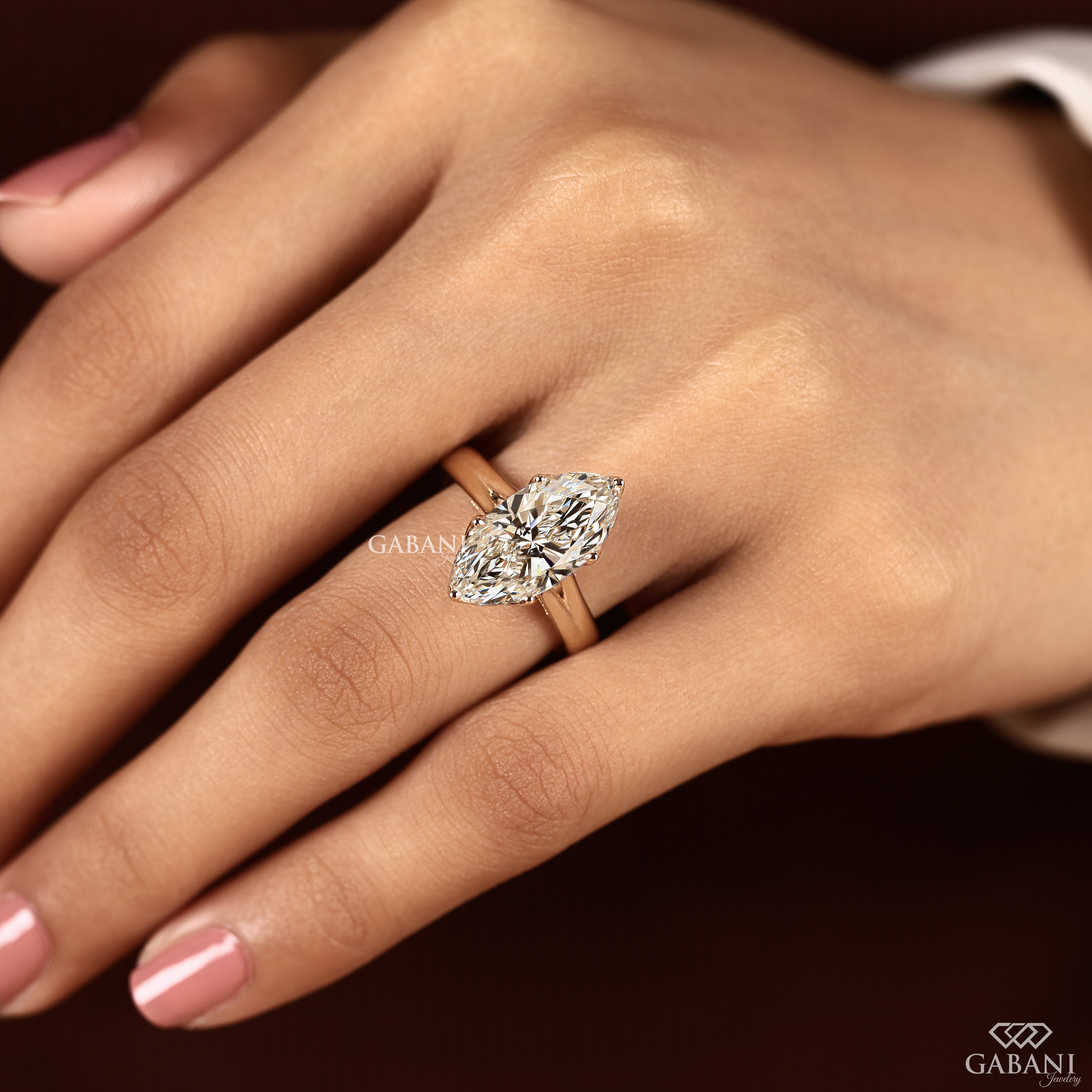 Marquise cut engagement ring with hidden basket diamonds and tulip basket setting