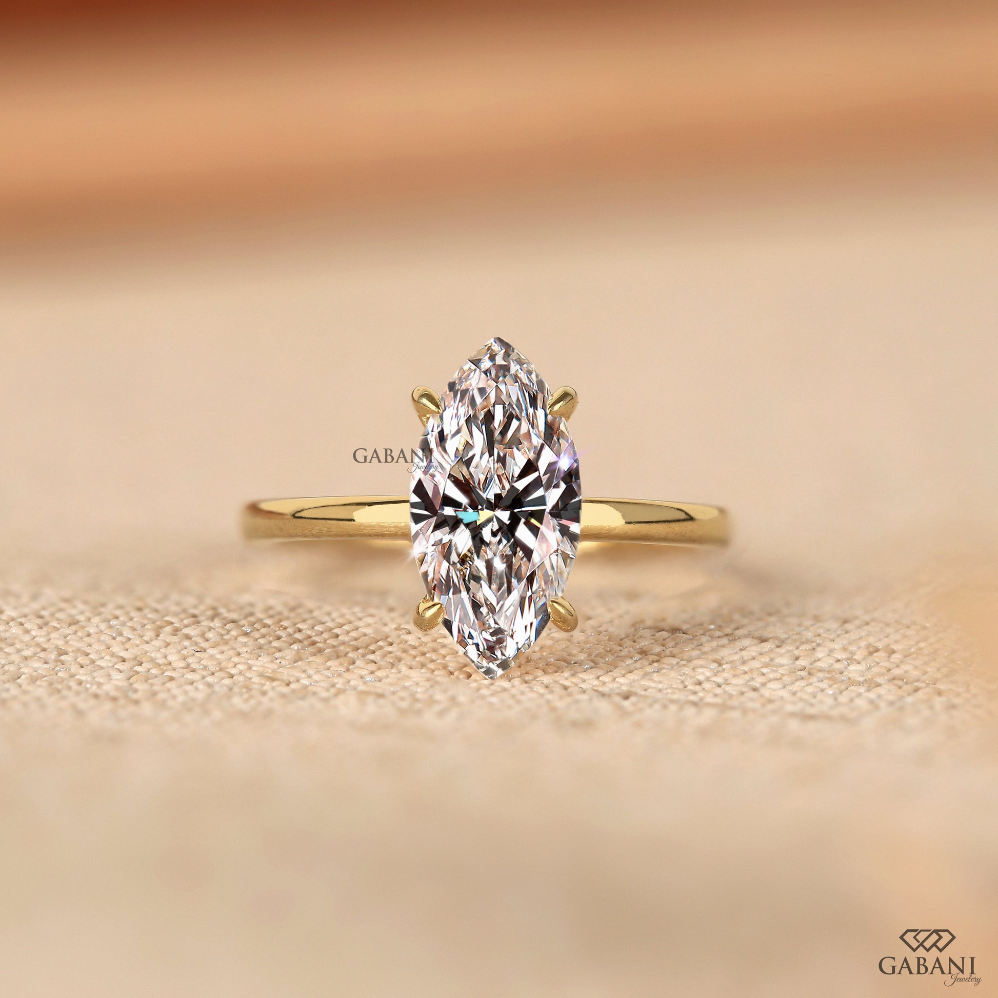 gabani jewelry marquise cut lab grown diamond solitaire ring in gold with prong set basket and simple pipe shank