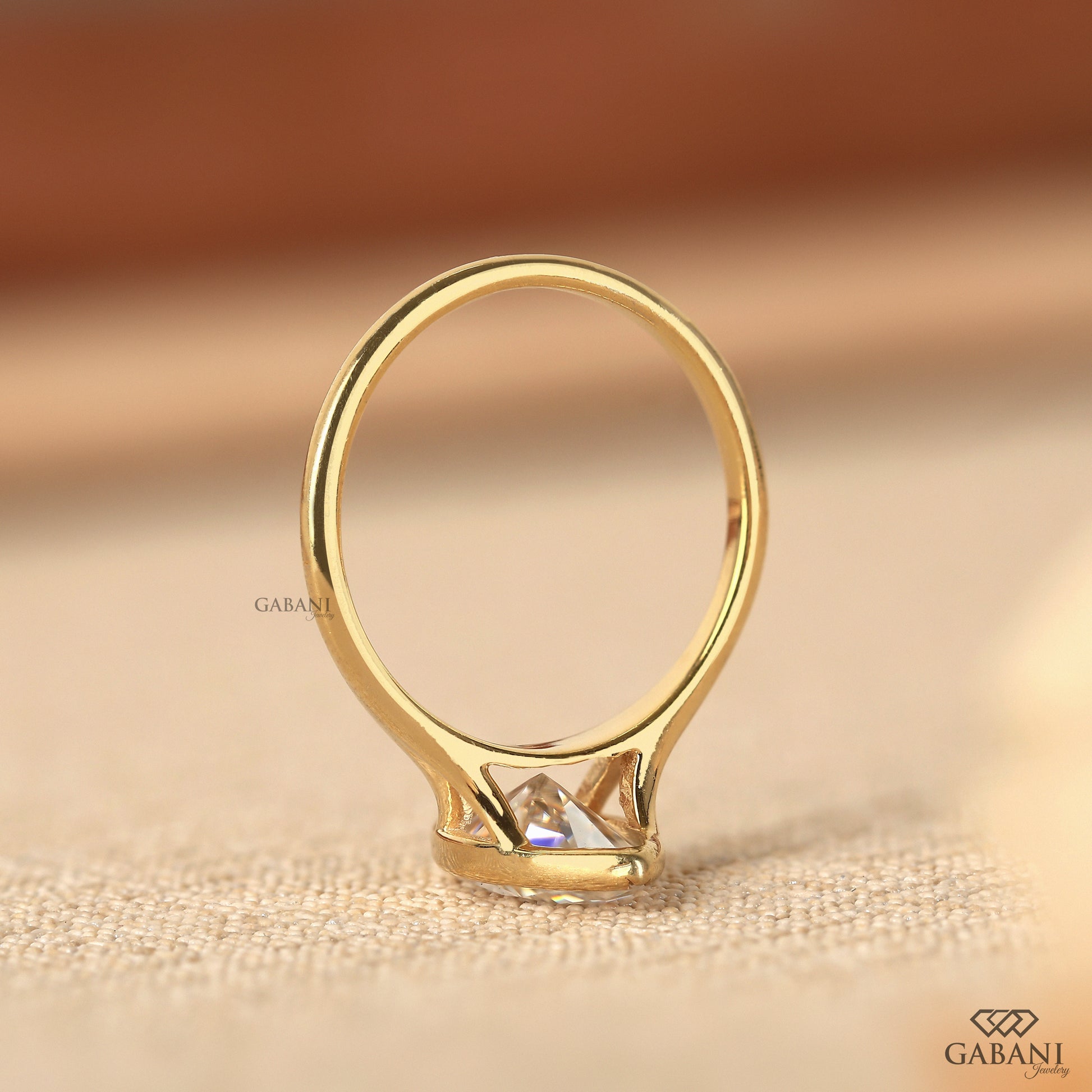 Lab grown marquise diamond ring in yellow gold with minimalist bezel style