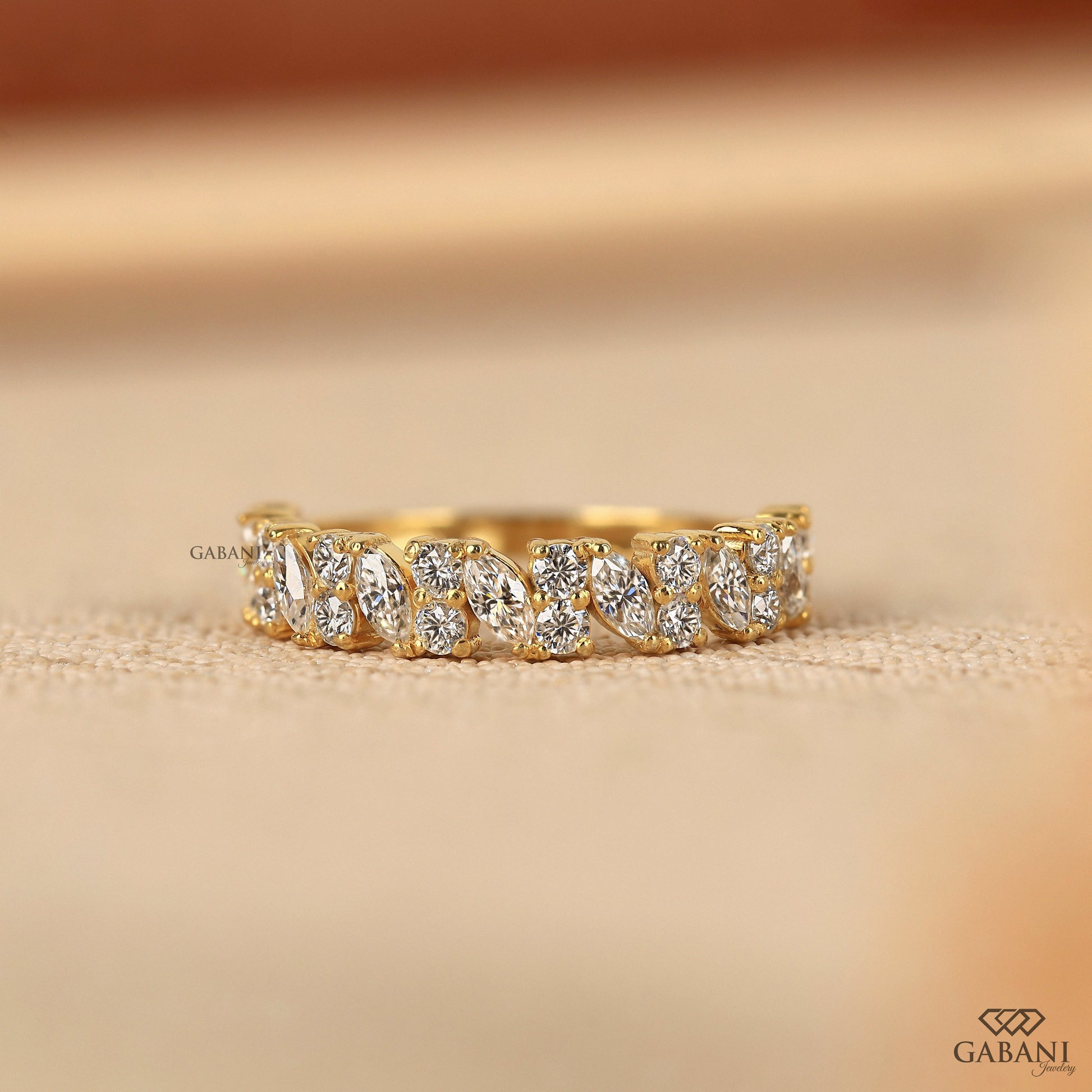 half eternity wedding band with alternating marquise and round lab grown diamonds set in smooth yellow gold