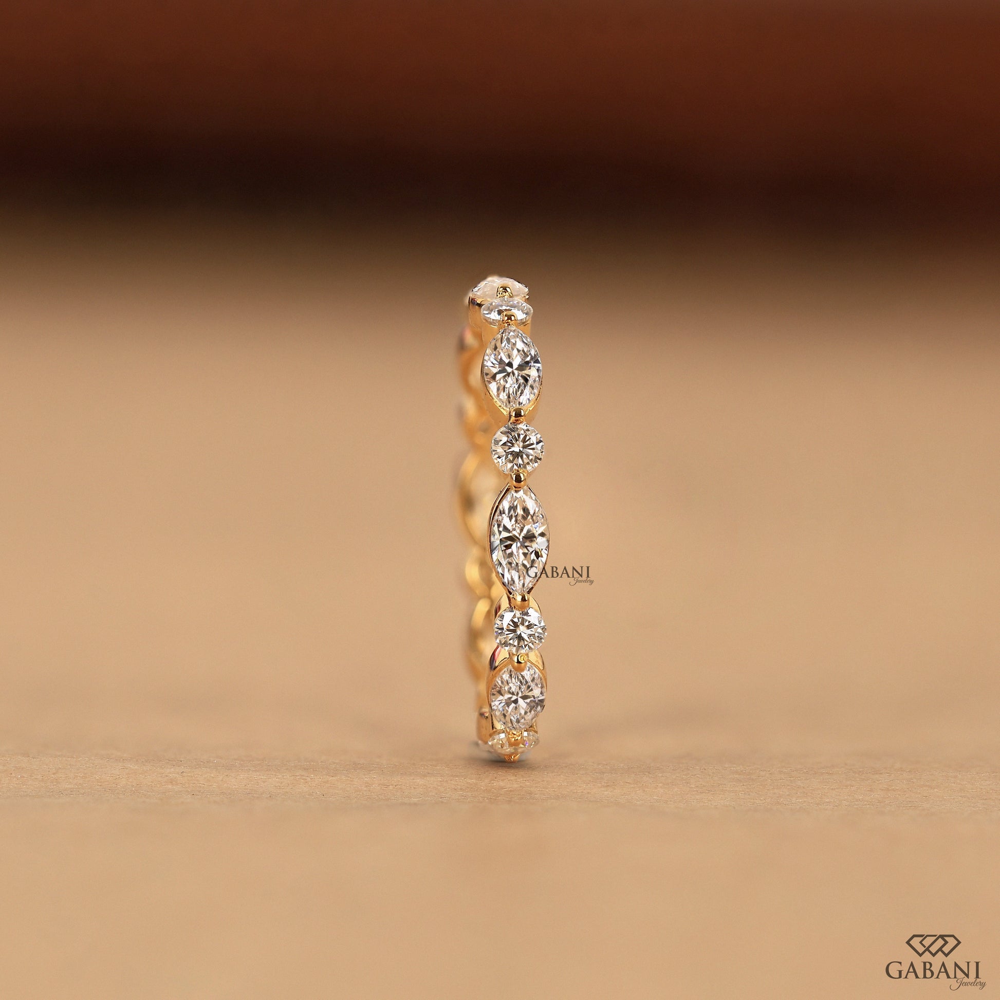 marquise and round diamond band in gold gabani jewelry