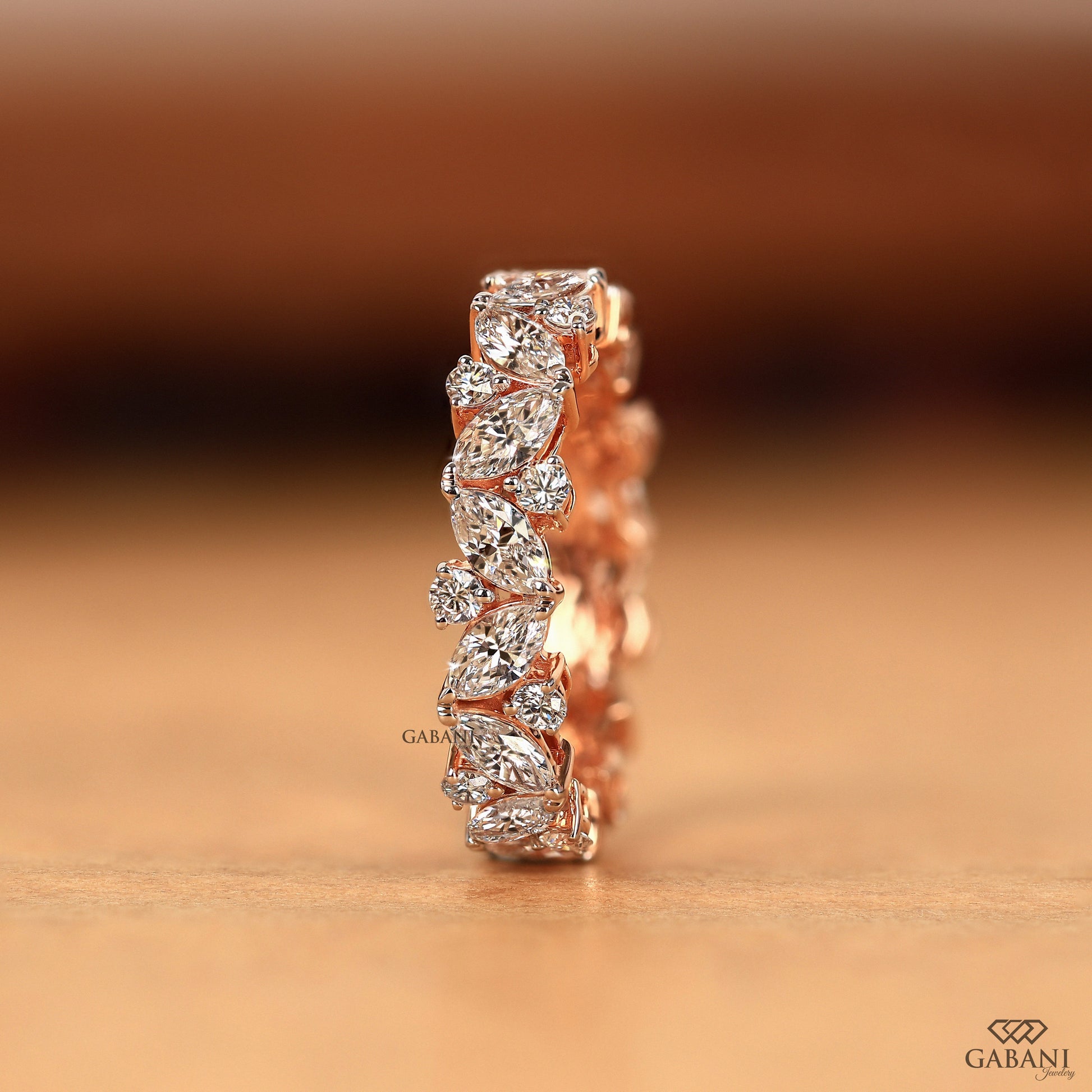 rose gold lab diamond band with alternating marquise and round diamonds