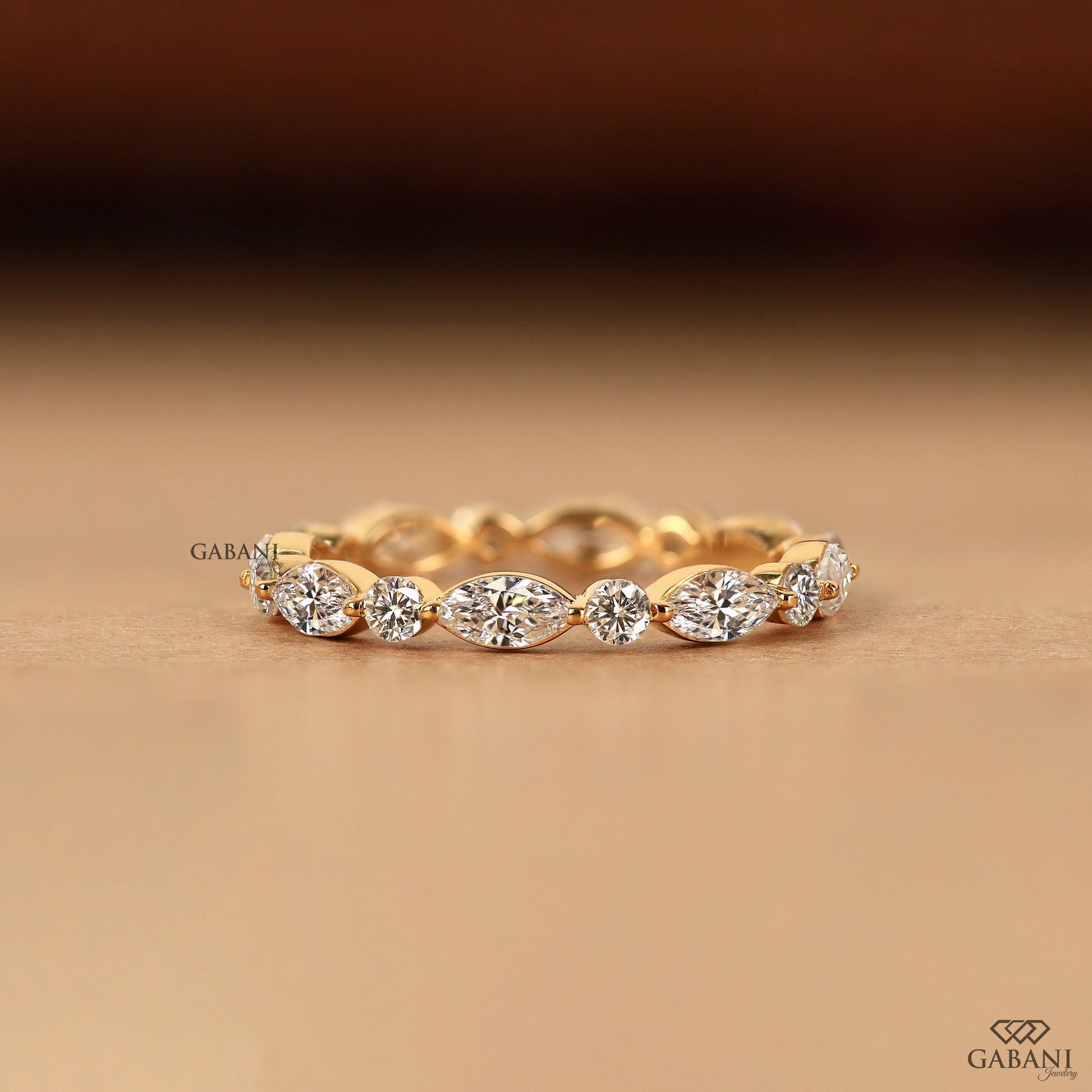 marquise round diamond eternity band in gold gabani jewelry