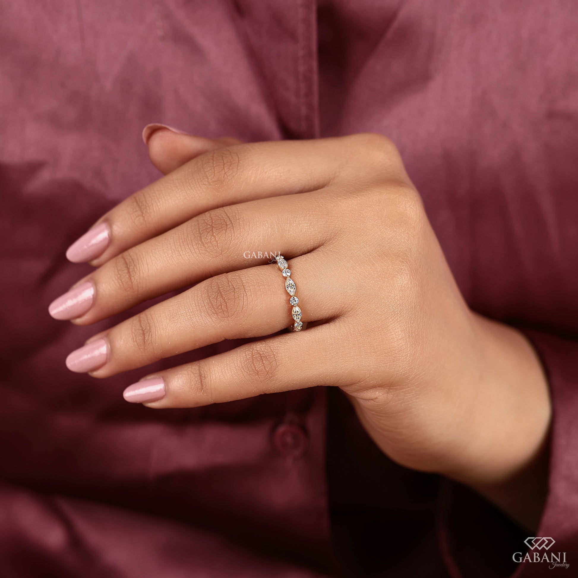 marquise diamond band with round stones in gold wedding ring