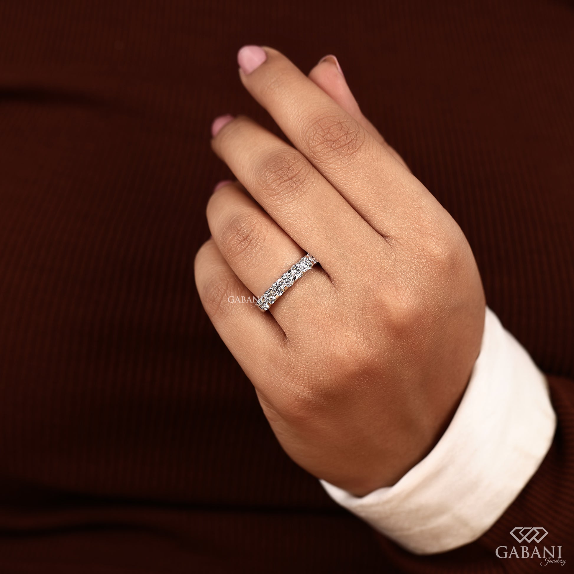 7 stone lab grown round diamond band with French pavé setting in smooth white gold