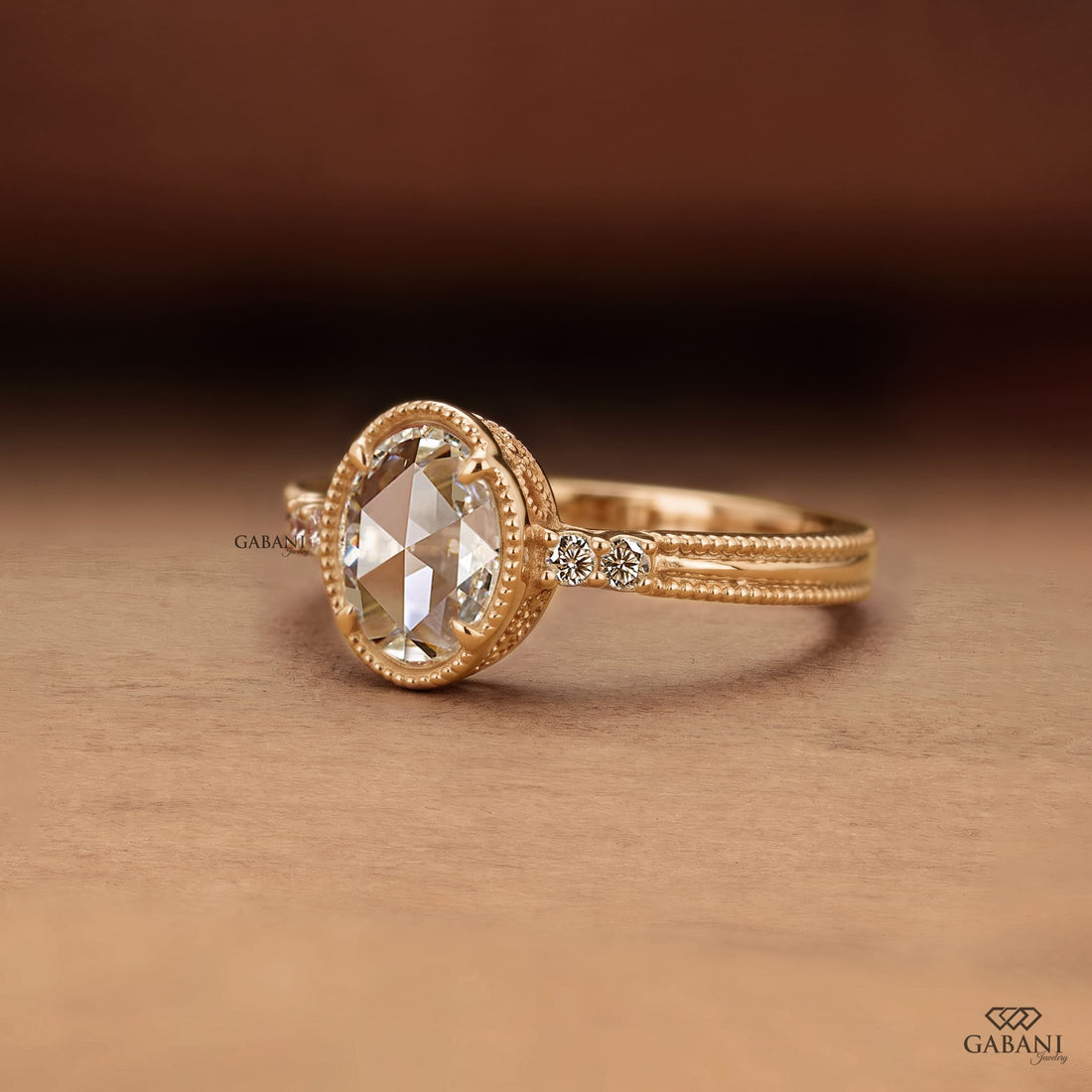 Oval rose cut lab grown diamond engagement ring with round side diamonds, vintage milgrain detailing and split shank design.