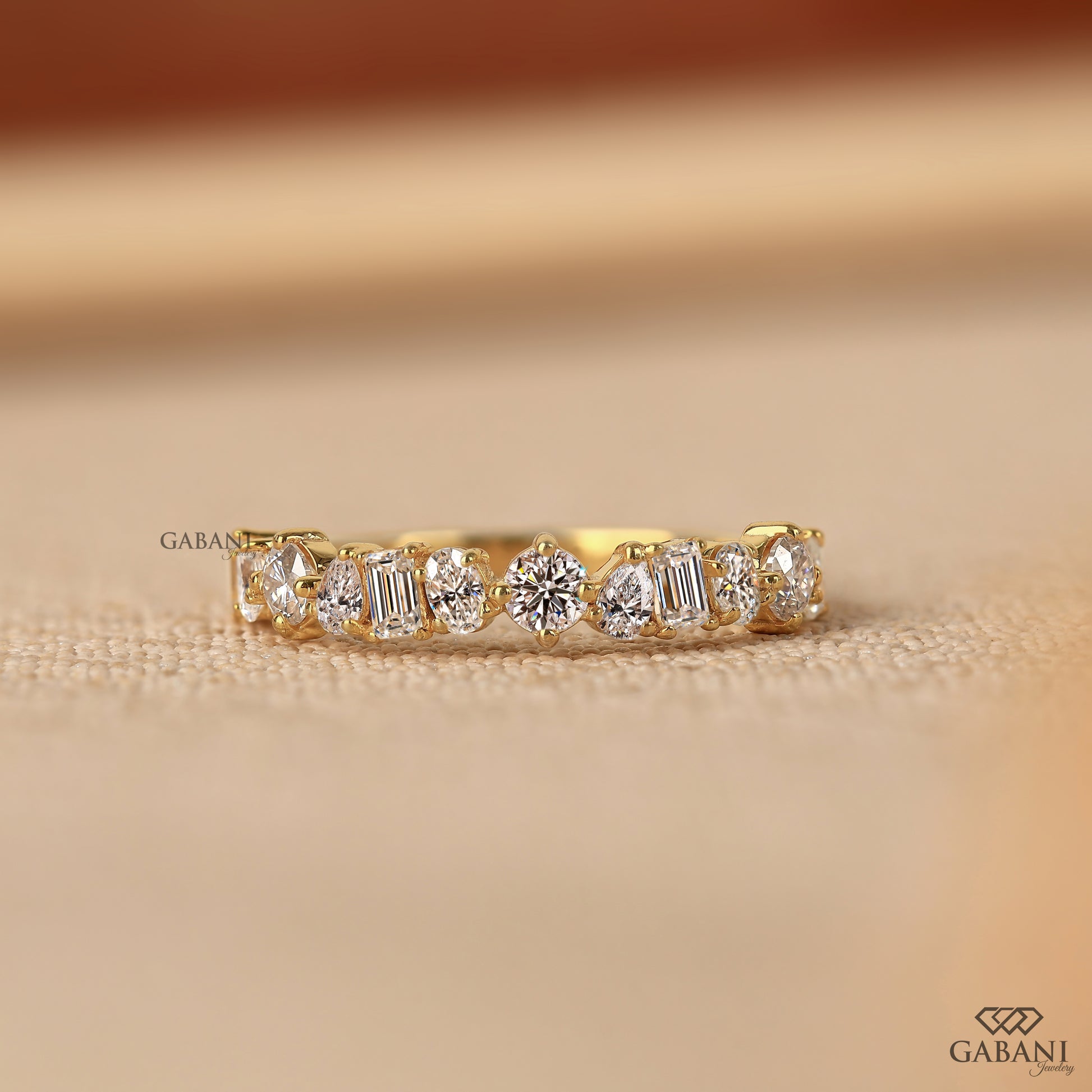 Lab grown diamond wedding band with mixed diamond shapes and sleek pipe shank style
