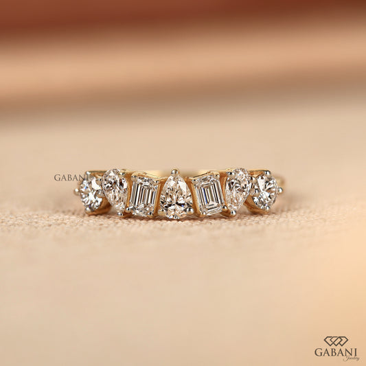 Lab grown diamond wedding band with emerald pear and round cuts in yellow gold