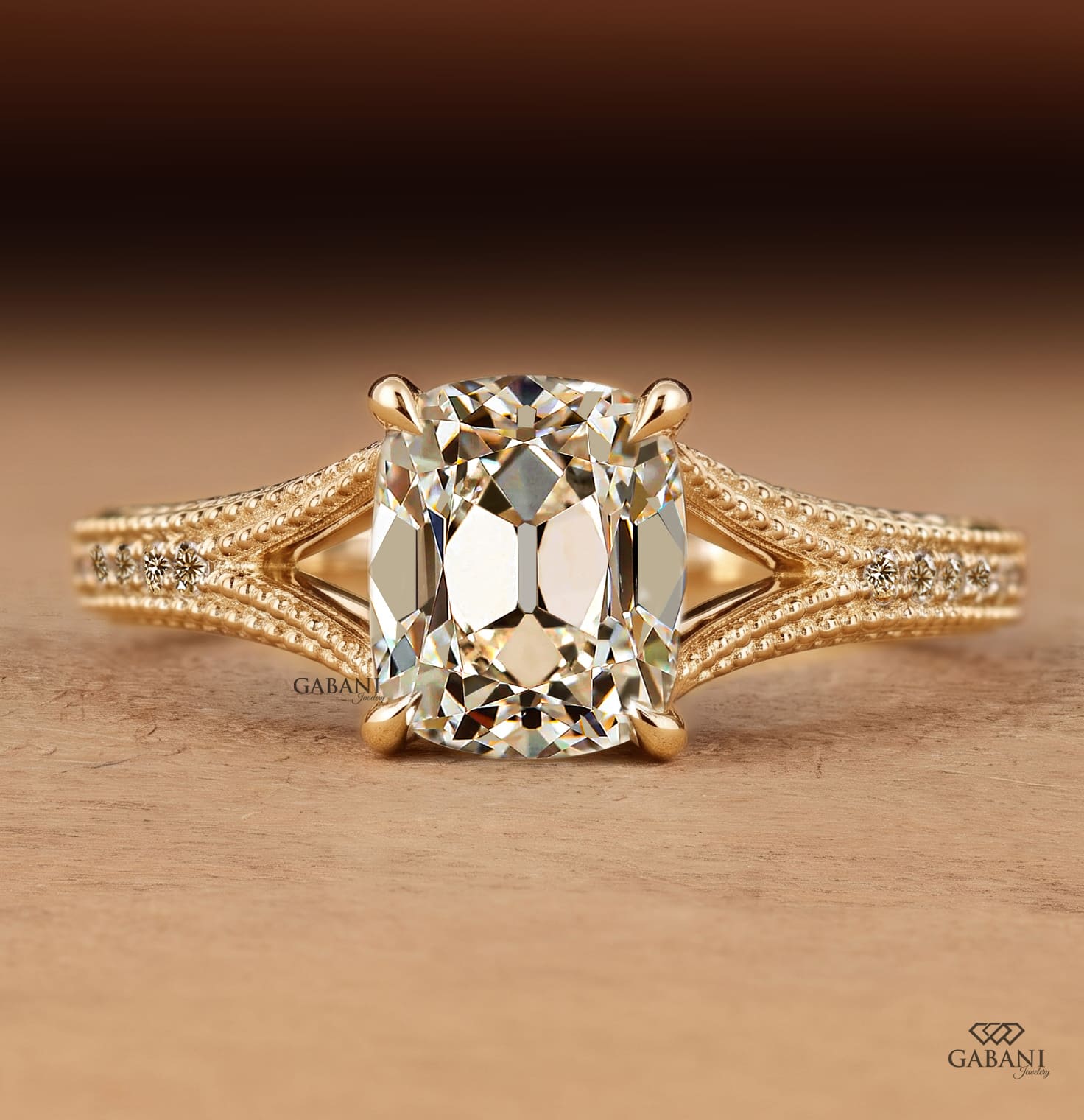 old mine cushion cut lab grown diamond engagement ring with split shank, round diamond accents and milgrain detail