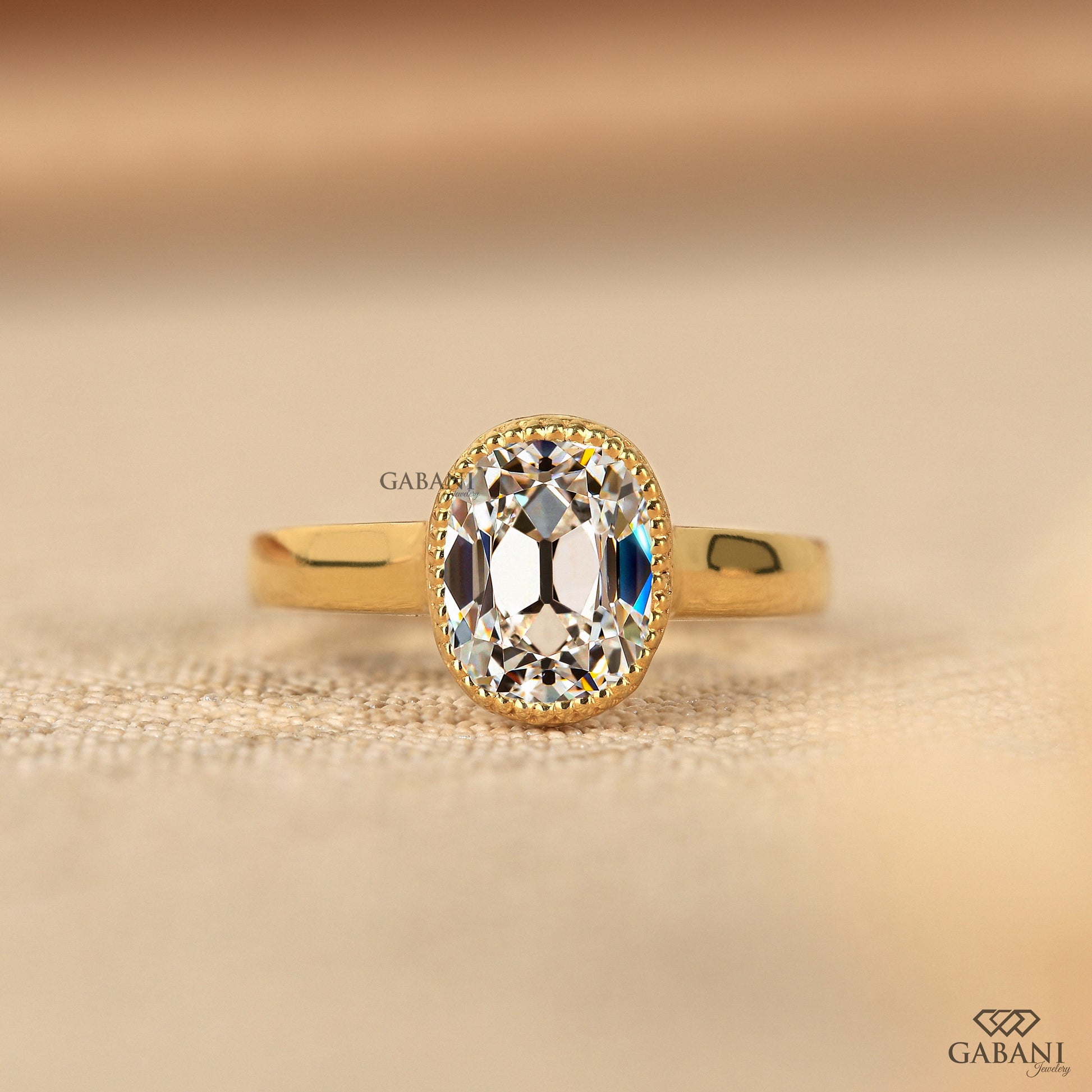 Gabani Jewelry old mine cushion cut lab grown diamond solitaire ring with IGI certified center stone and bezel setting