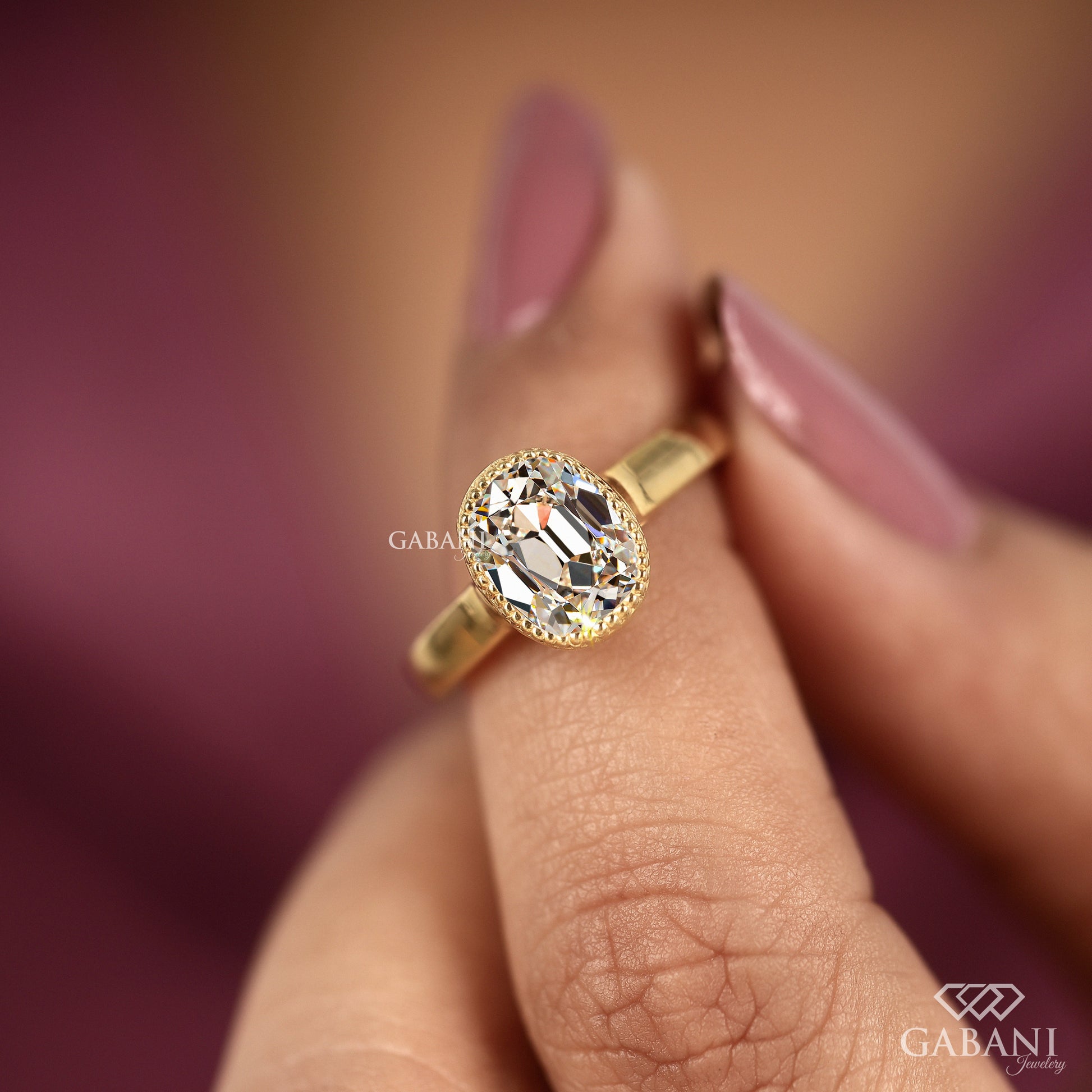 Simple solitaire ring with old mine cut lab grown diamond and protective bezel setting