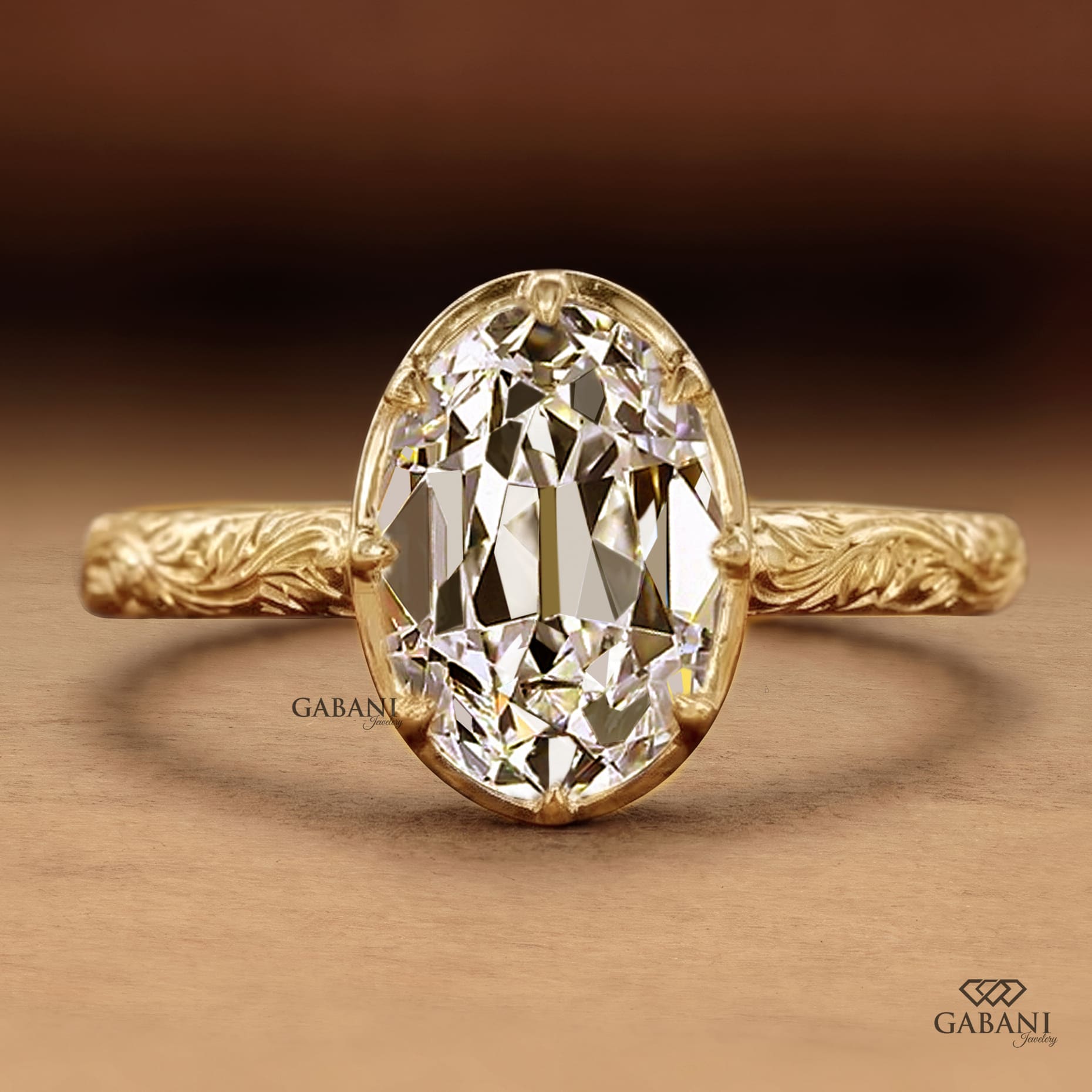 Oval old mine cut lab grown diamond engagement ring in 18K yellow gold with a vintage engraved band and antique-inspired detailing.
