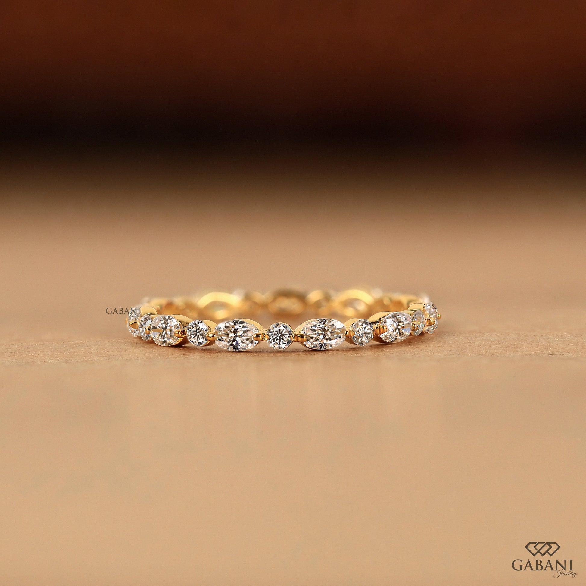 oval and round lab grown diamond eternity band in yellow gold