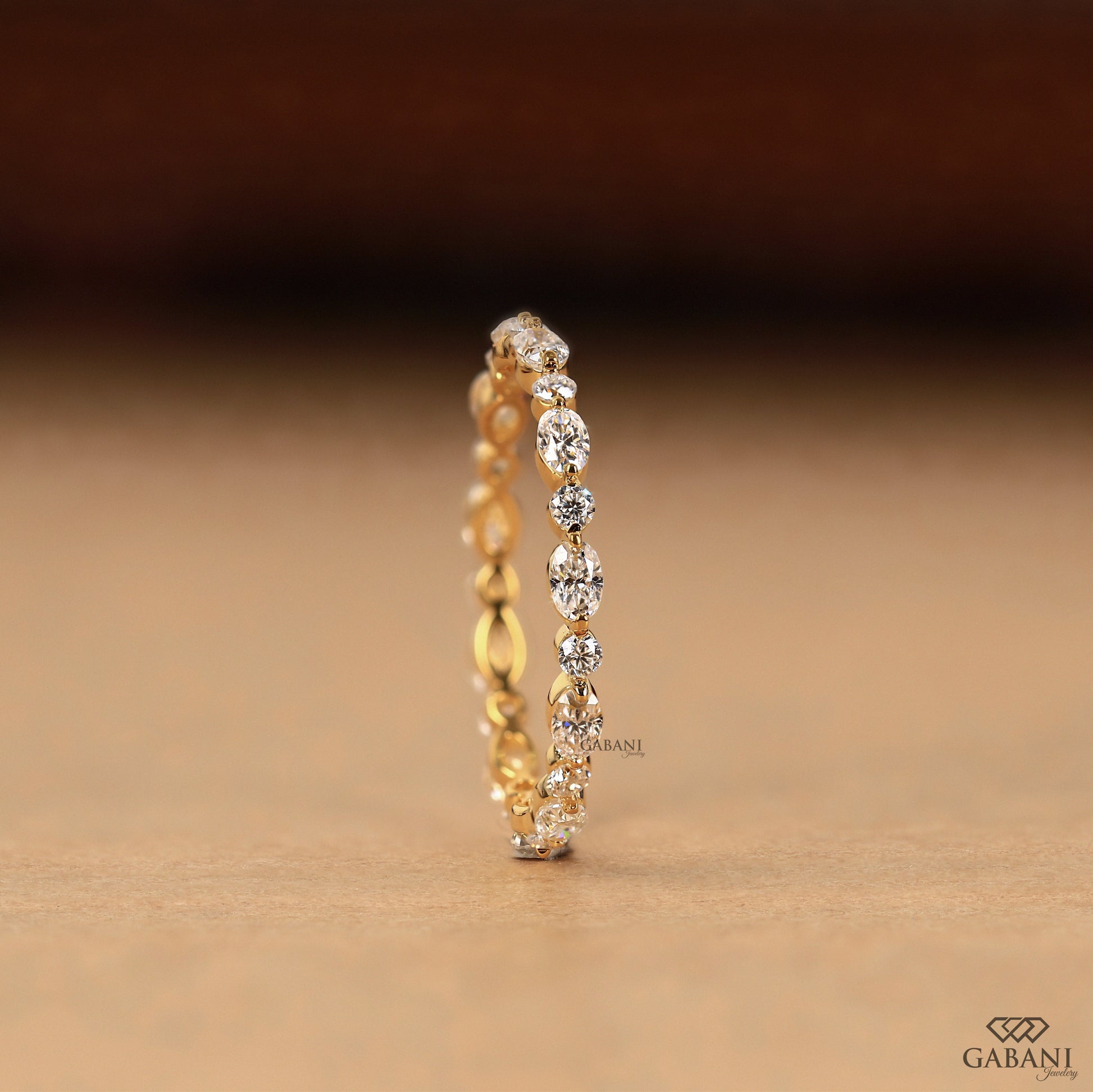 minimal lab grown diamond wedding band with oval round stones