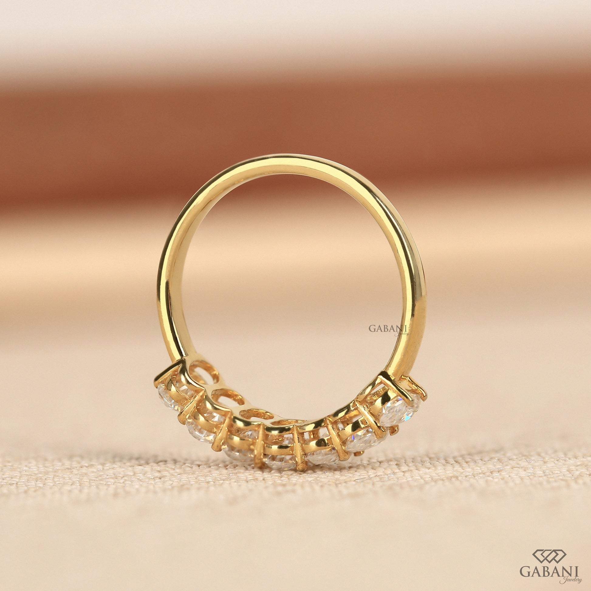 half eternity oval lab grown diamond band in 14k yellow gold with elegant proportions