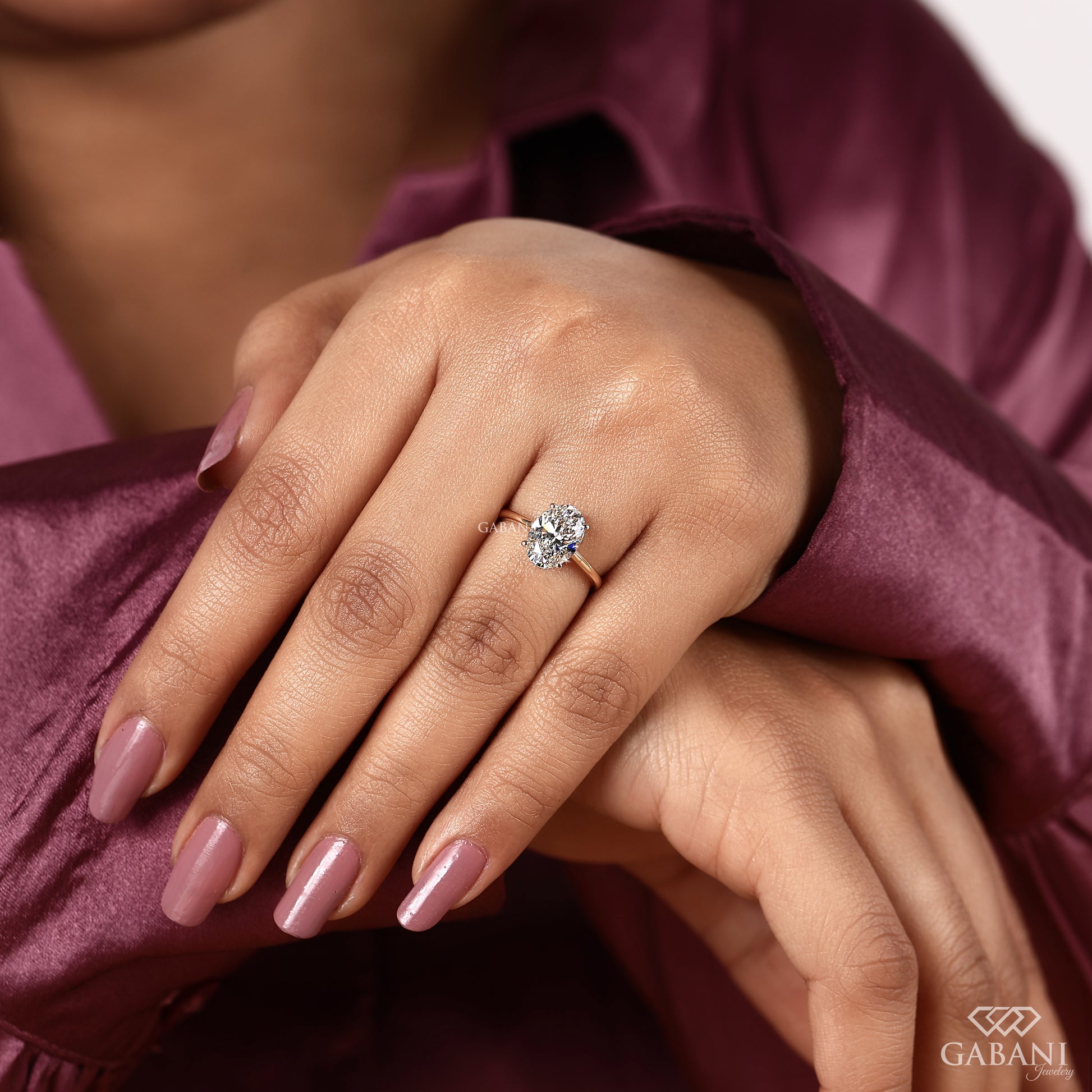 classic oval solitaire lab grown diamond ring in yellow gold with four button prongs