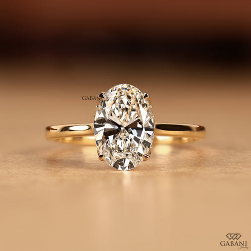Front view of an oval cut lab grown diamond solitaire ring showcasing the IGI Certified center diamond with a refined hidden halo and graceful tulip setting.
