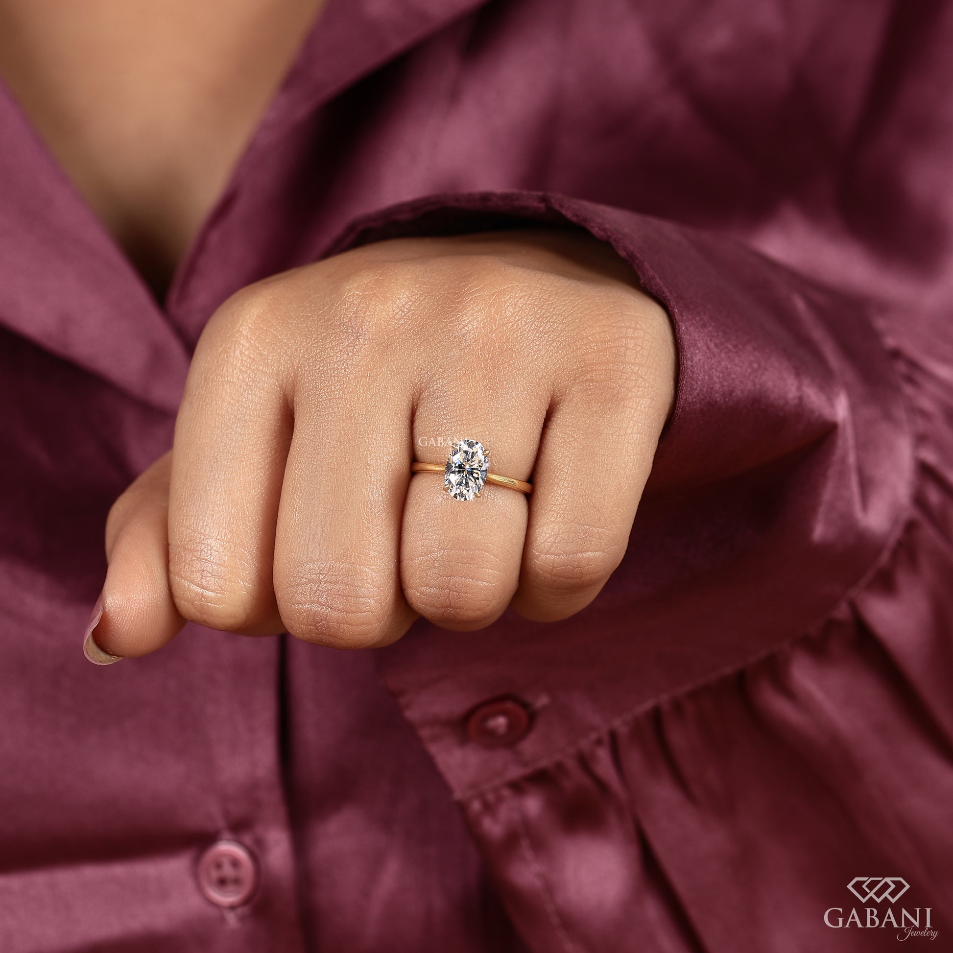 oval shaped lab grown diamond engagement ring featuring a clean solitaire layout and notch setting