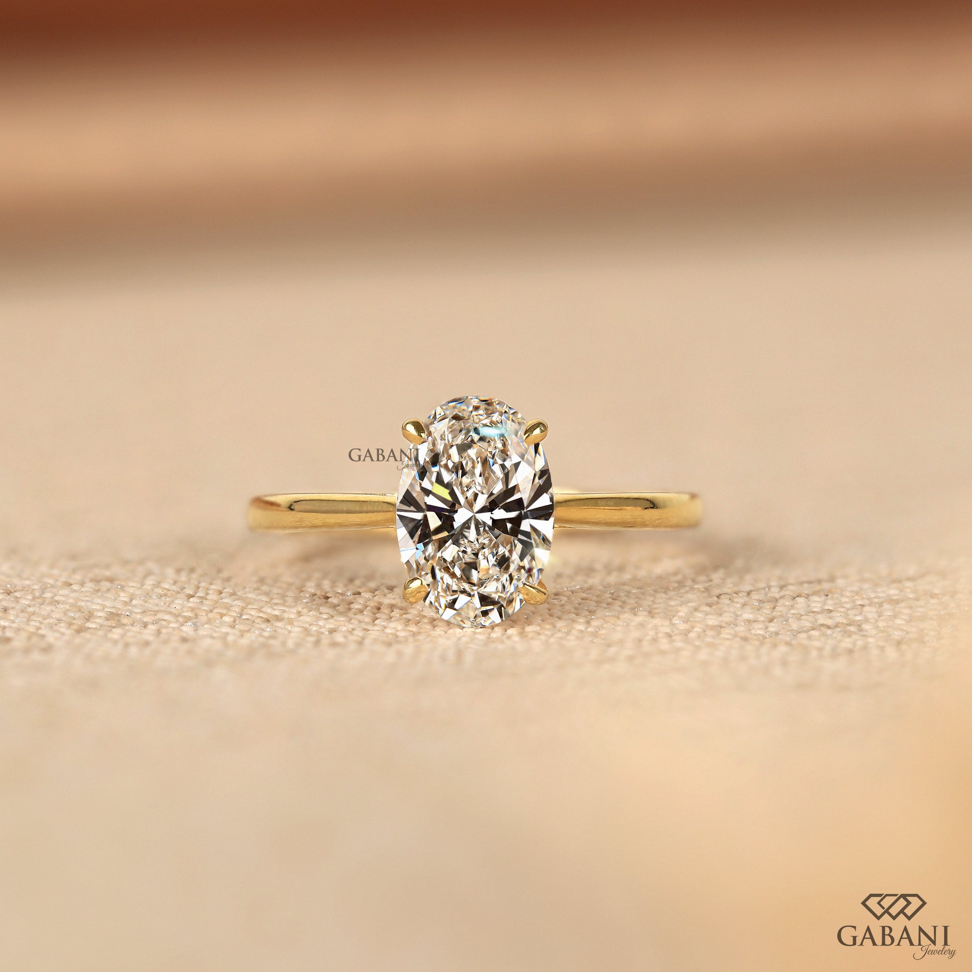 oval cut lab grown diamond solitaire ring with tulip basket and notch setting, low profile design with clean polished finish