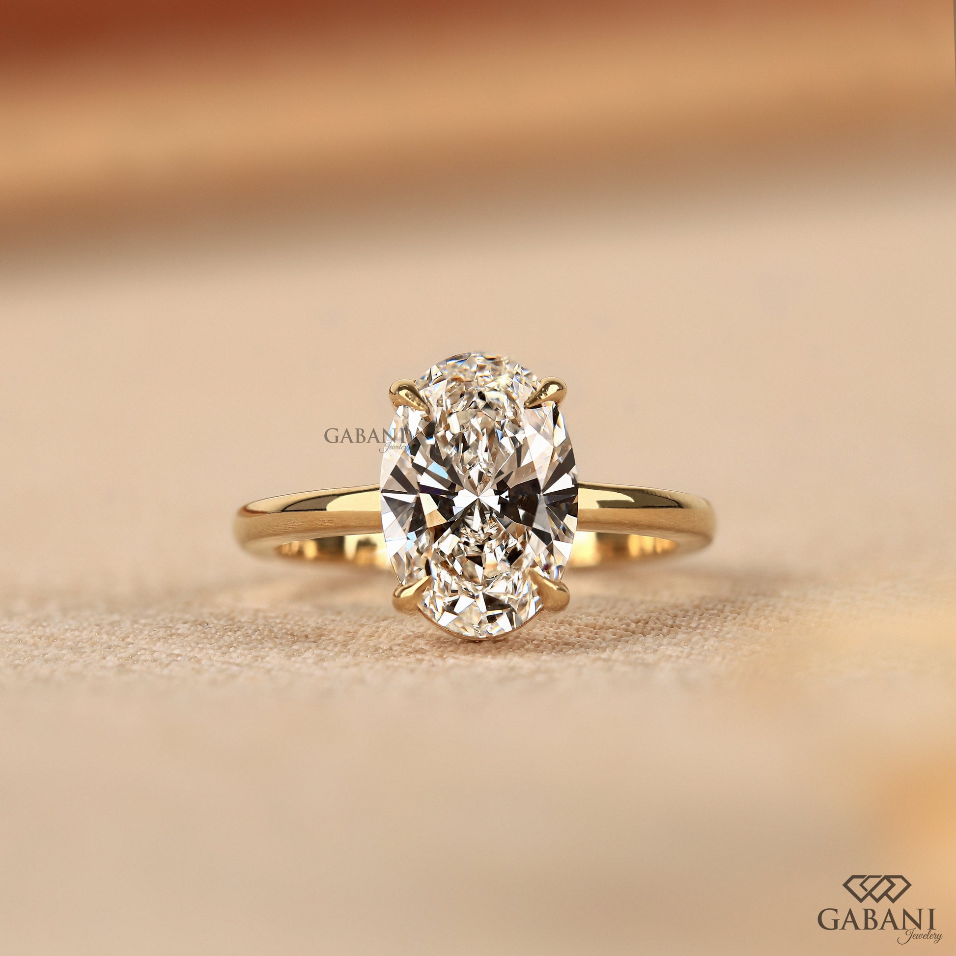 oval lab grown diamond solitaire ring in yellow gold
