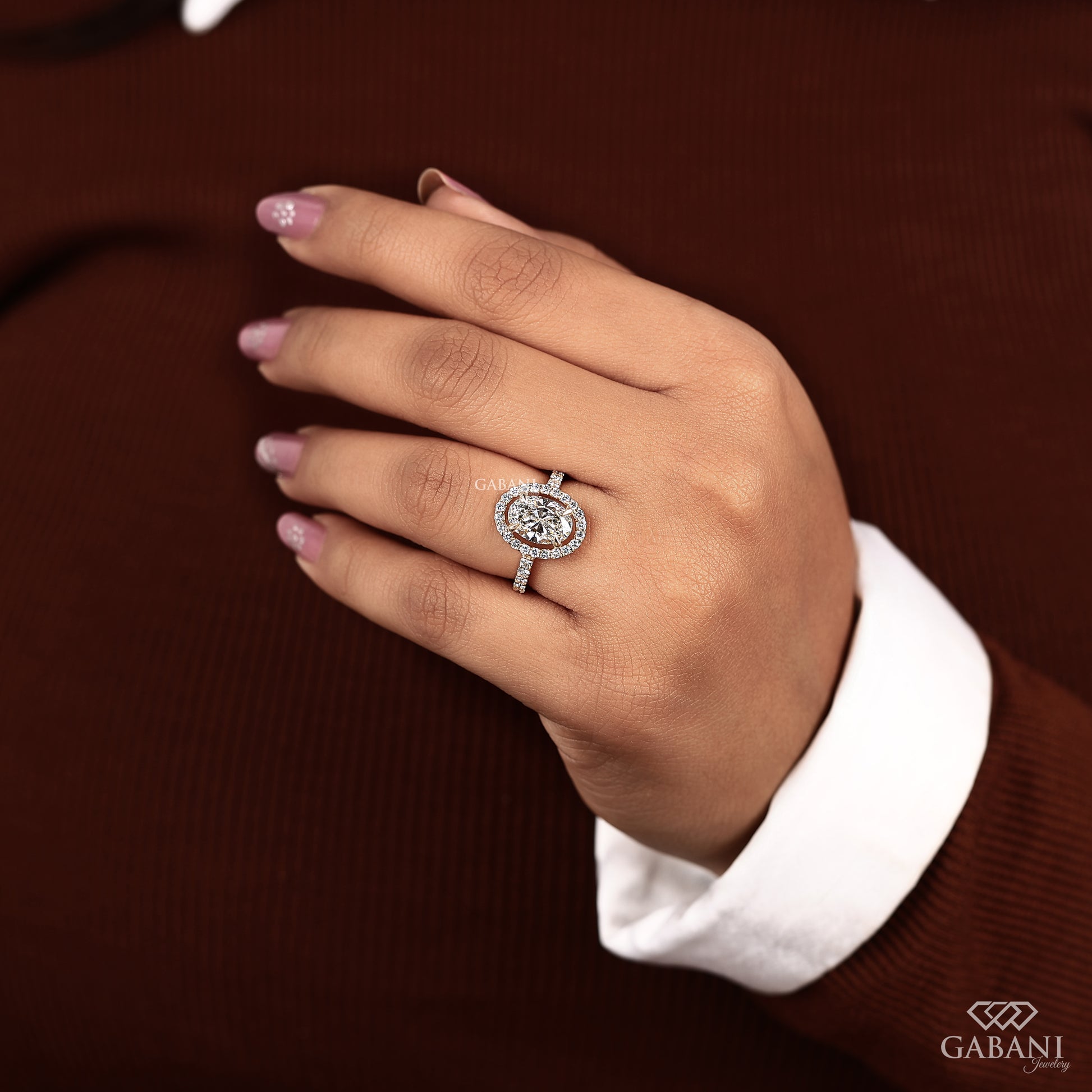 Yellow gold oval cut lab grown diamond ring with pave halo