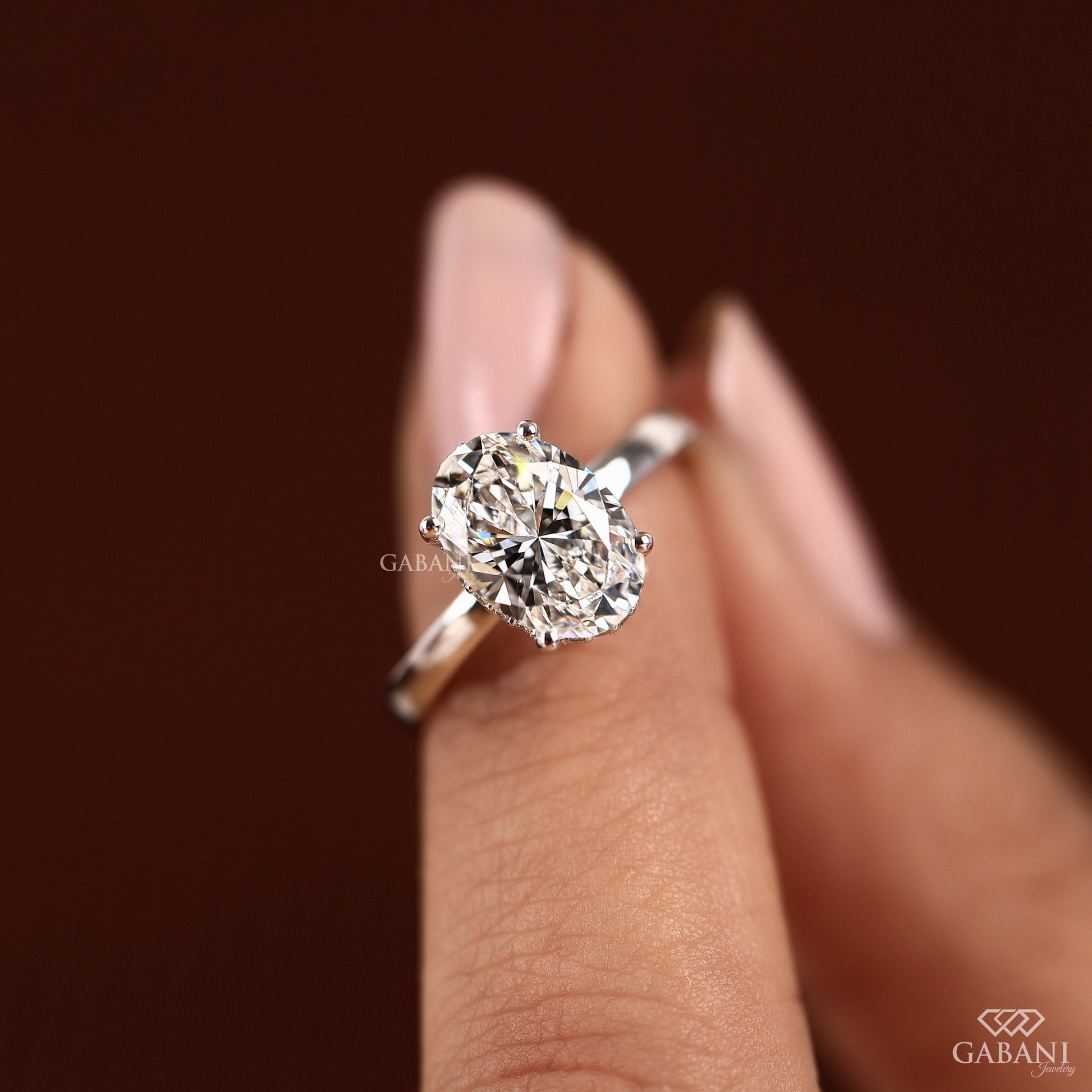 oval cut diamond ring in white gold with subtle hidden halo detail