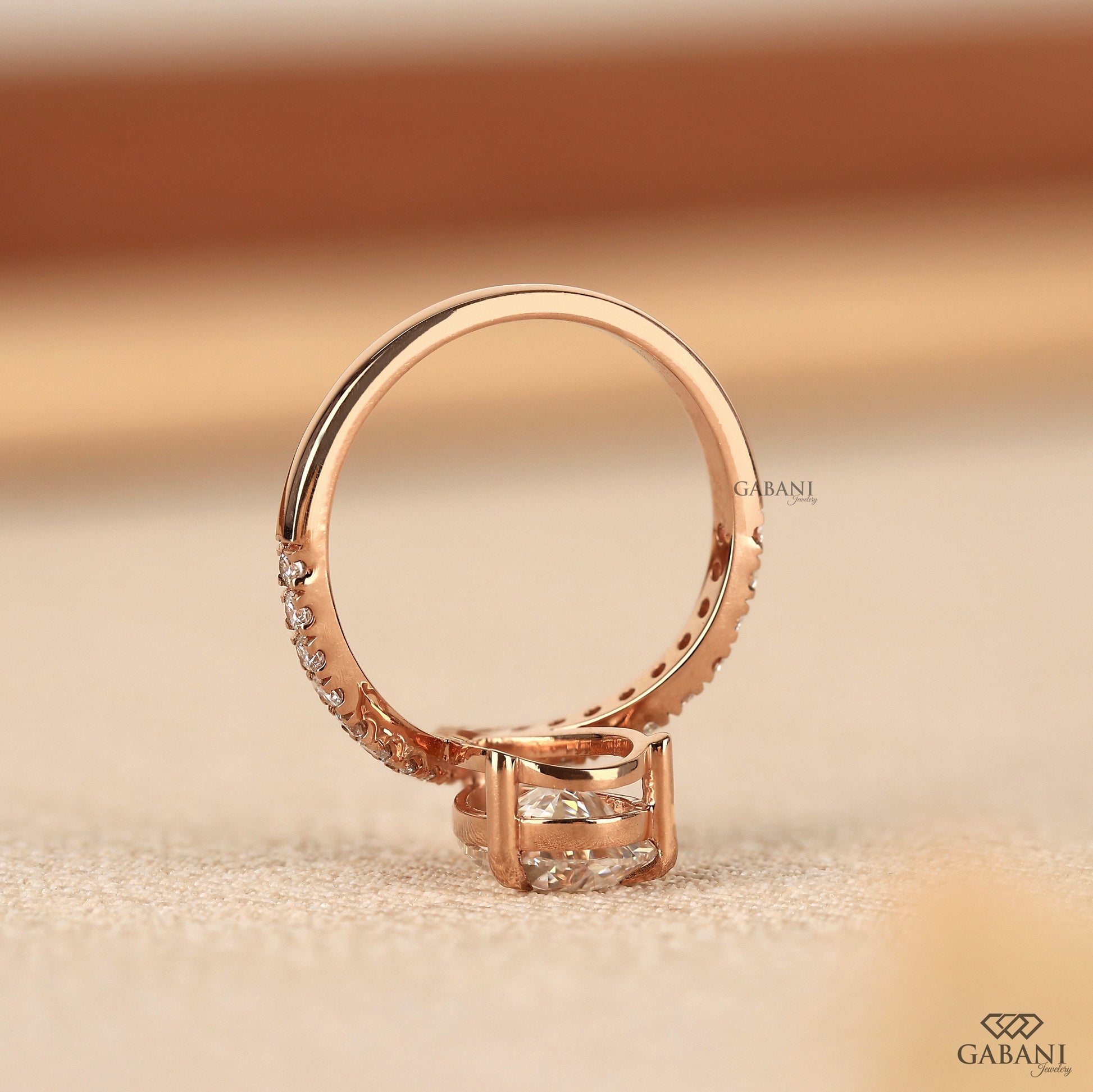 Rose gold V band ring with pear shaped lab grown diamond center