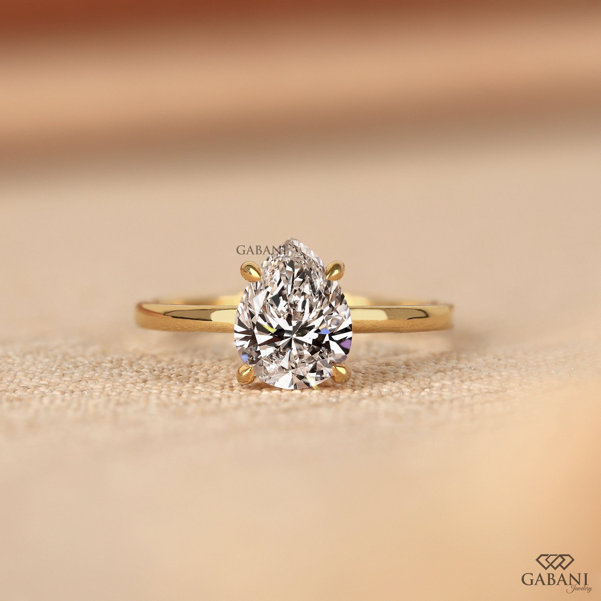 pear cut lab grown diamond solitaire ring in solid yellow gold with sleek comfort fit
