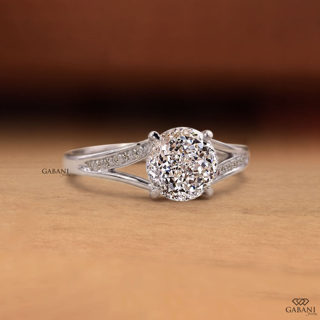 Round cut lab grown diamond engagement ring with split shank, pavé side stones, four-prong setting, and polished white gold band.
