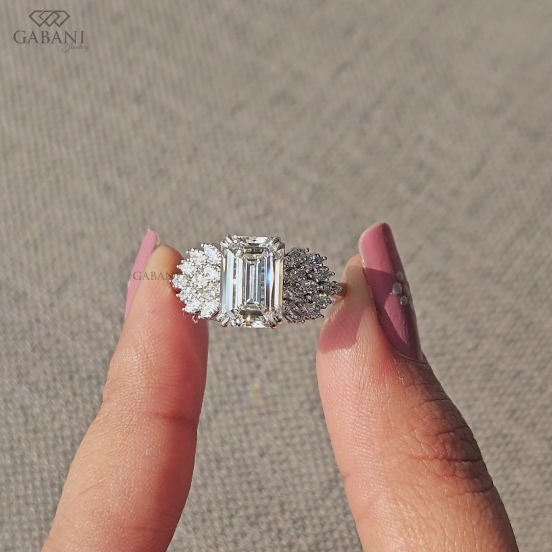 emerald cut lab diamond three stone cluster ring with winged marquise accents in white gold