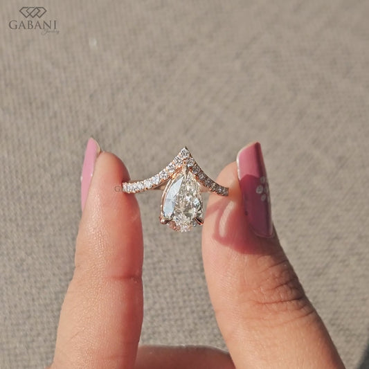 V shaped solitaire ring with pear lab grown diamond and round pavé accents in rose gold