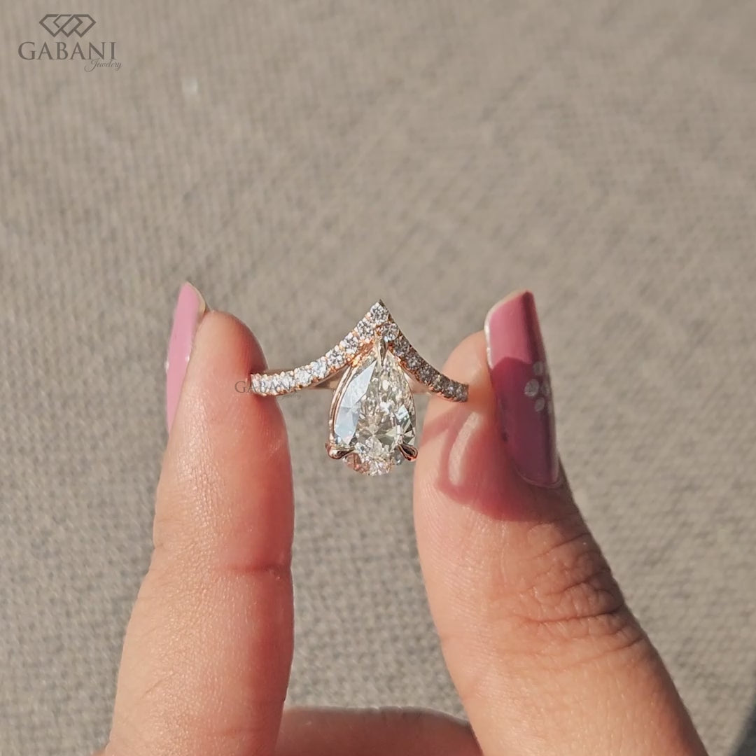 V shaped solitaire ring with pear lab grown diamond and round pavé accents in rose gold