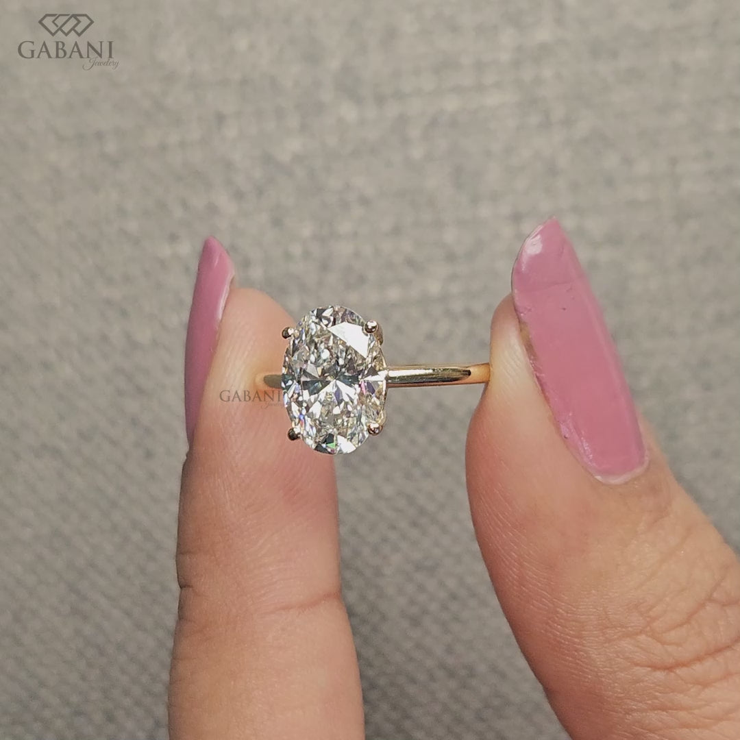 oval lab grown diamond ring in solitaire style with tulip basket setting and minimal low profile for everyday wear