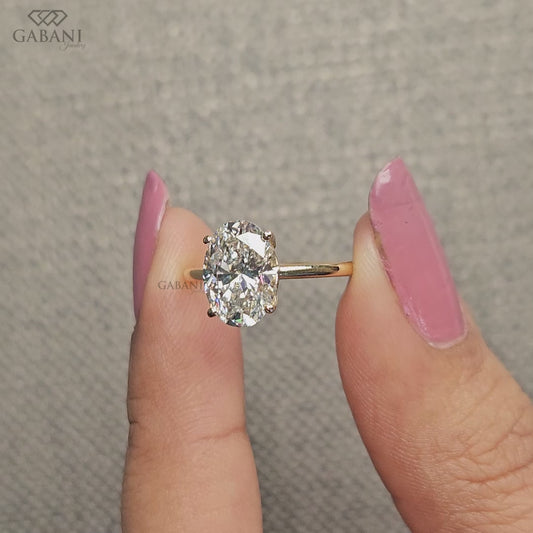 oval lab grown diamond ring in solitaire style with tulip basket setting and minimal low profile for everyday wear