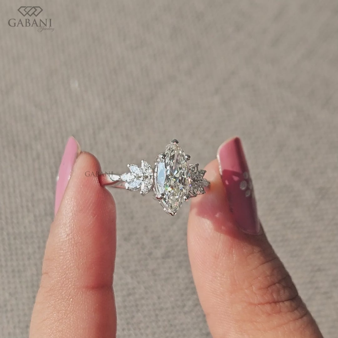 Marquise cut lab grown diamond engagement ring in white gold with elongated center stone and balanced side accents
