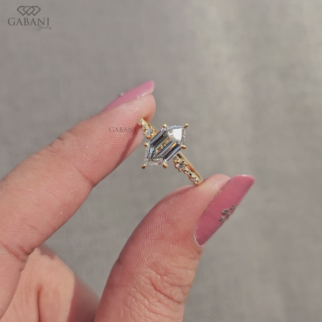 Art Deco hexagon cut diamond ring with side round stones in yellow gold