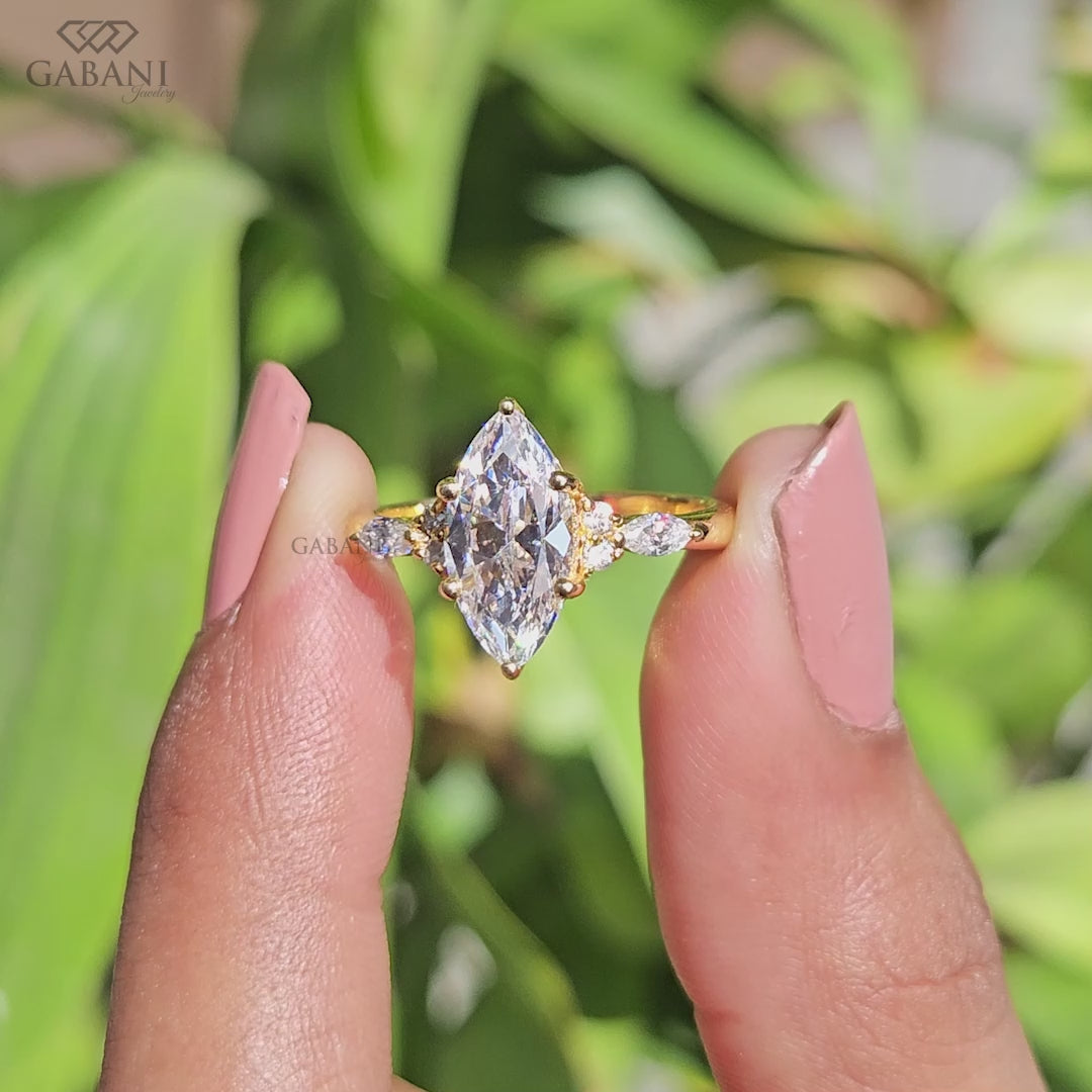 Marquise cut lab grown diamond ring with pear side accents