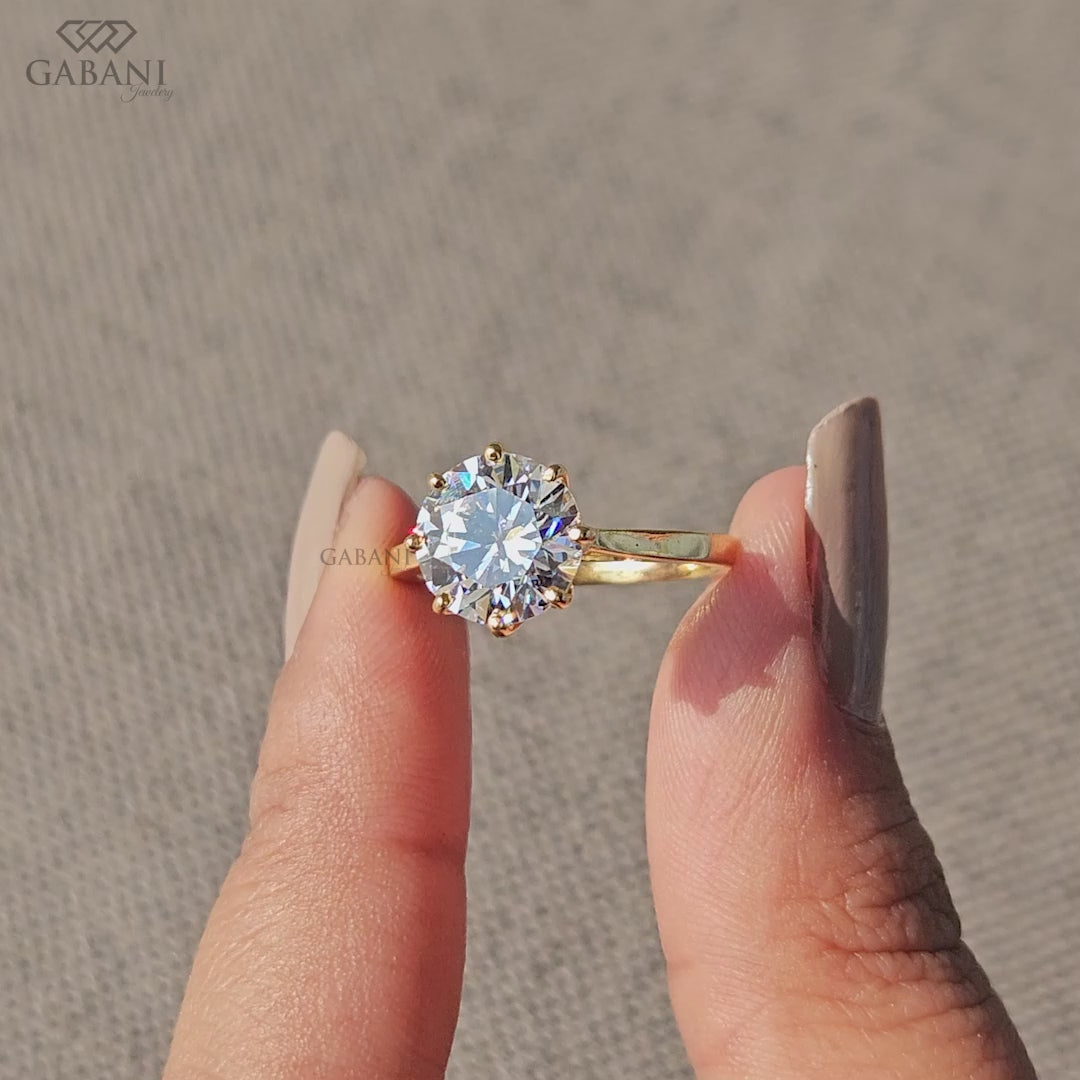 round cut lab grown diamond solitaire engagement ring in yellow gold with six prong tulip setting