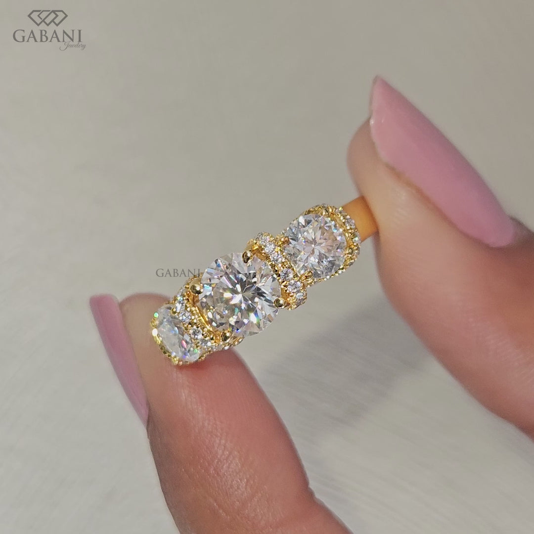 Classic Three Round Stone Diamond Engagement Ring With Milgrain Detail And Side Stones