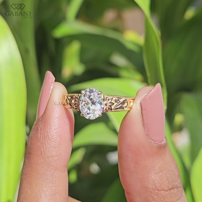 Nature inspired oval lab grown diamond ring with engraved leaf band