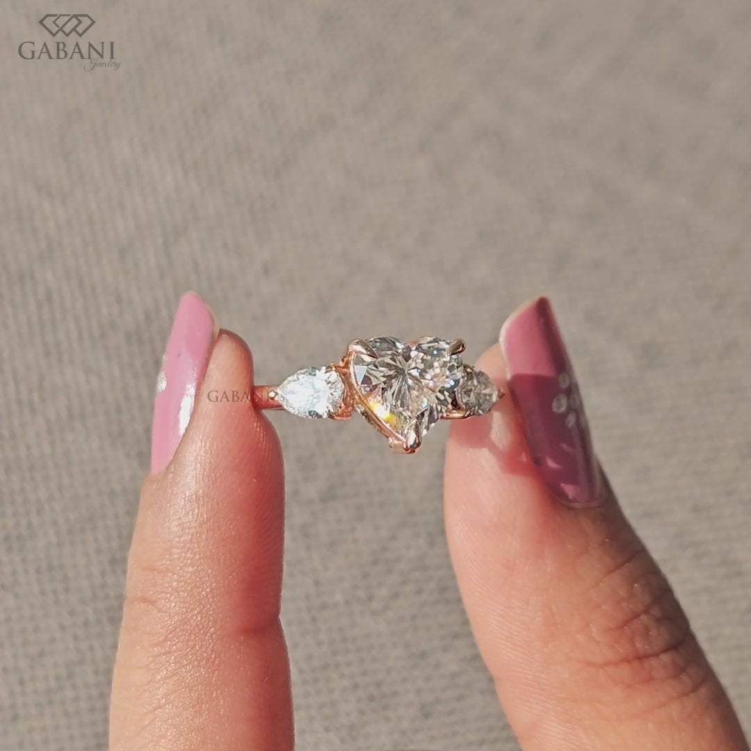 heart shaped three stone lab diamond ring with pear side stones